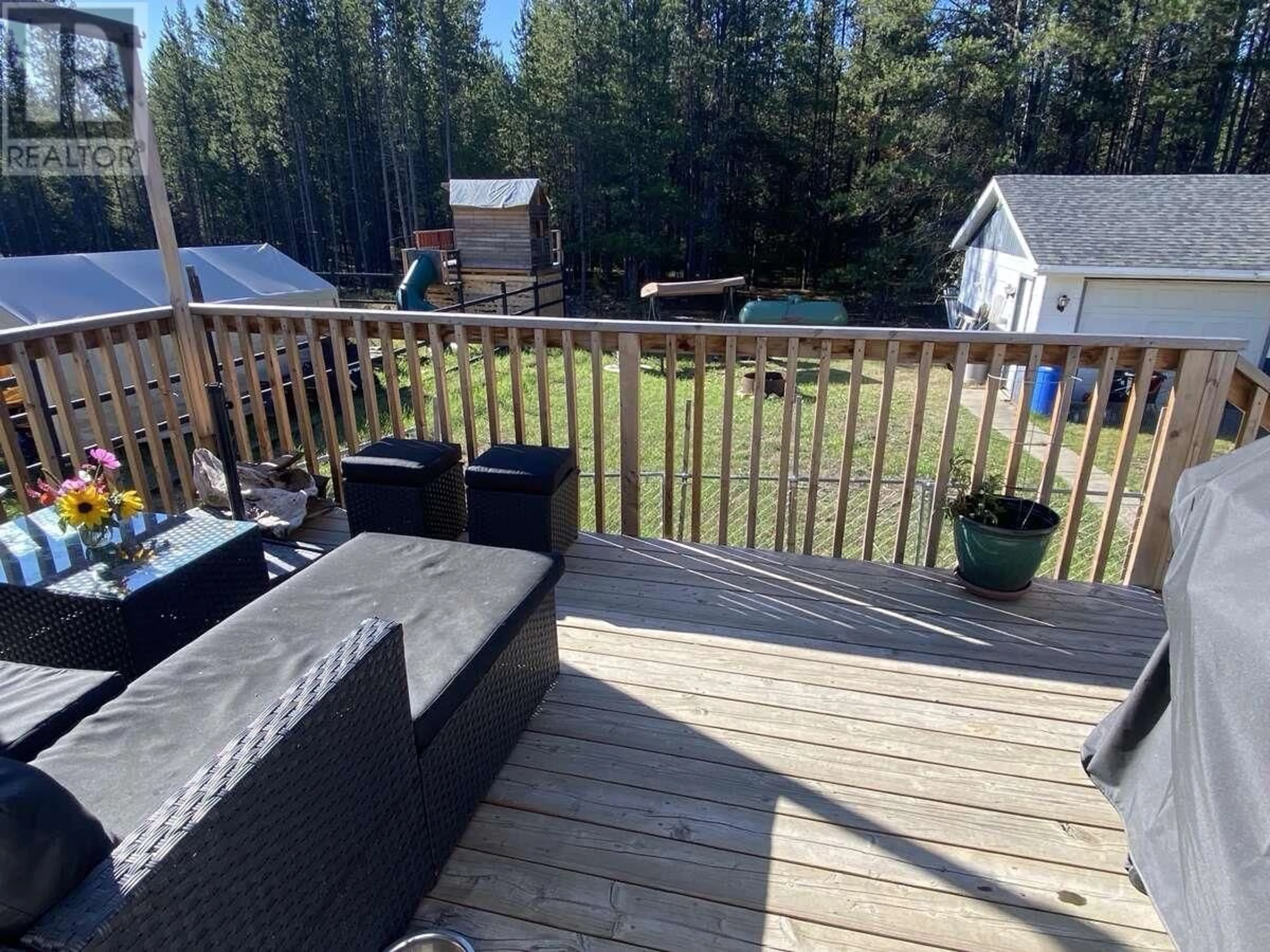 Patio, the fenced backyard for 1155 14TH AVENUE, Valemount British Columbia V0E2Z0