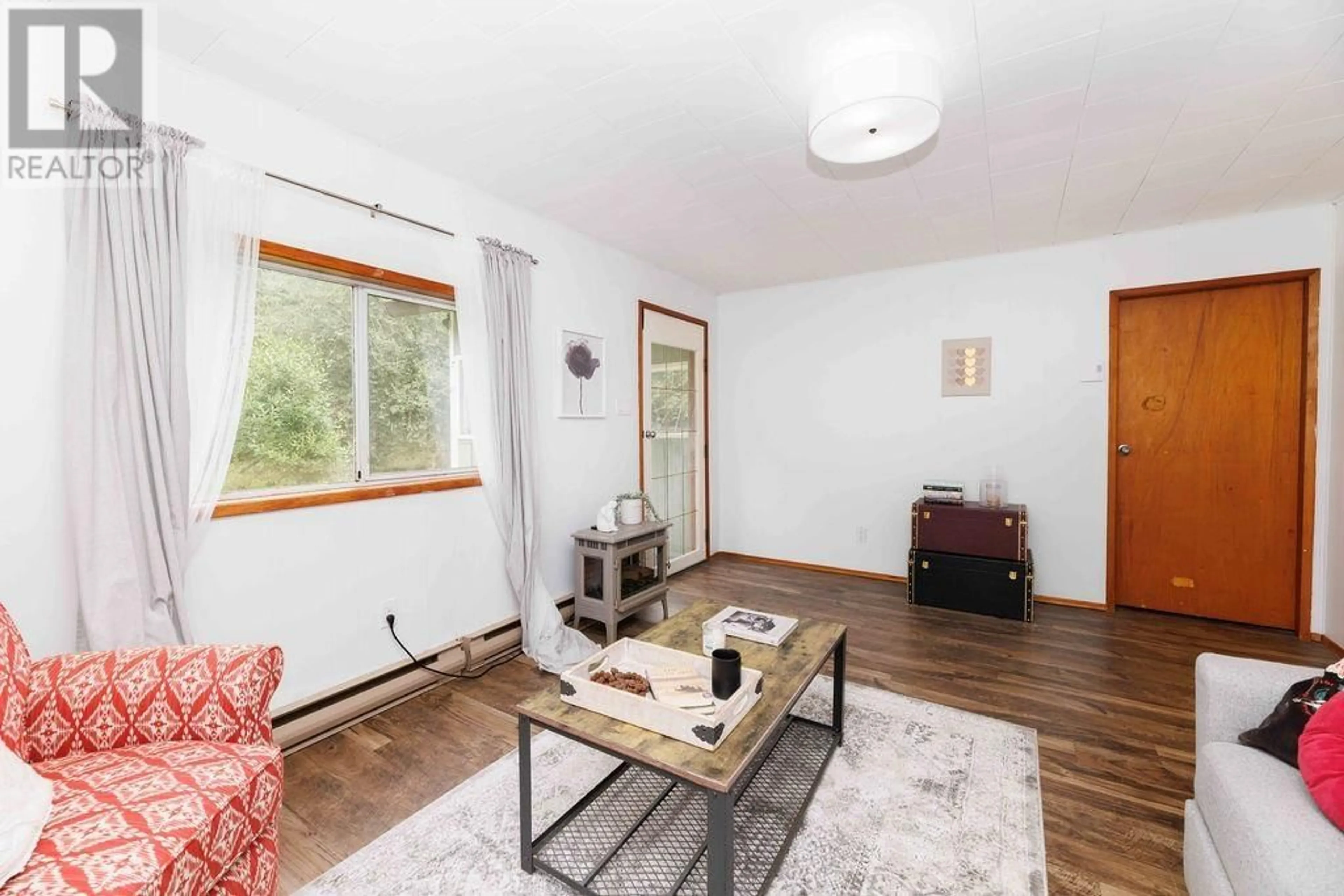 Living room, wood floors for 1225 ROBERTS CREEK ROAD, Roberts Creek British Columbia V0N2W2