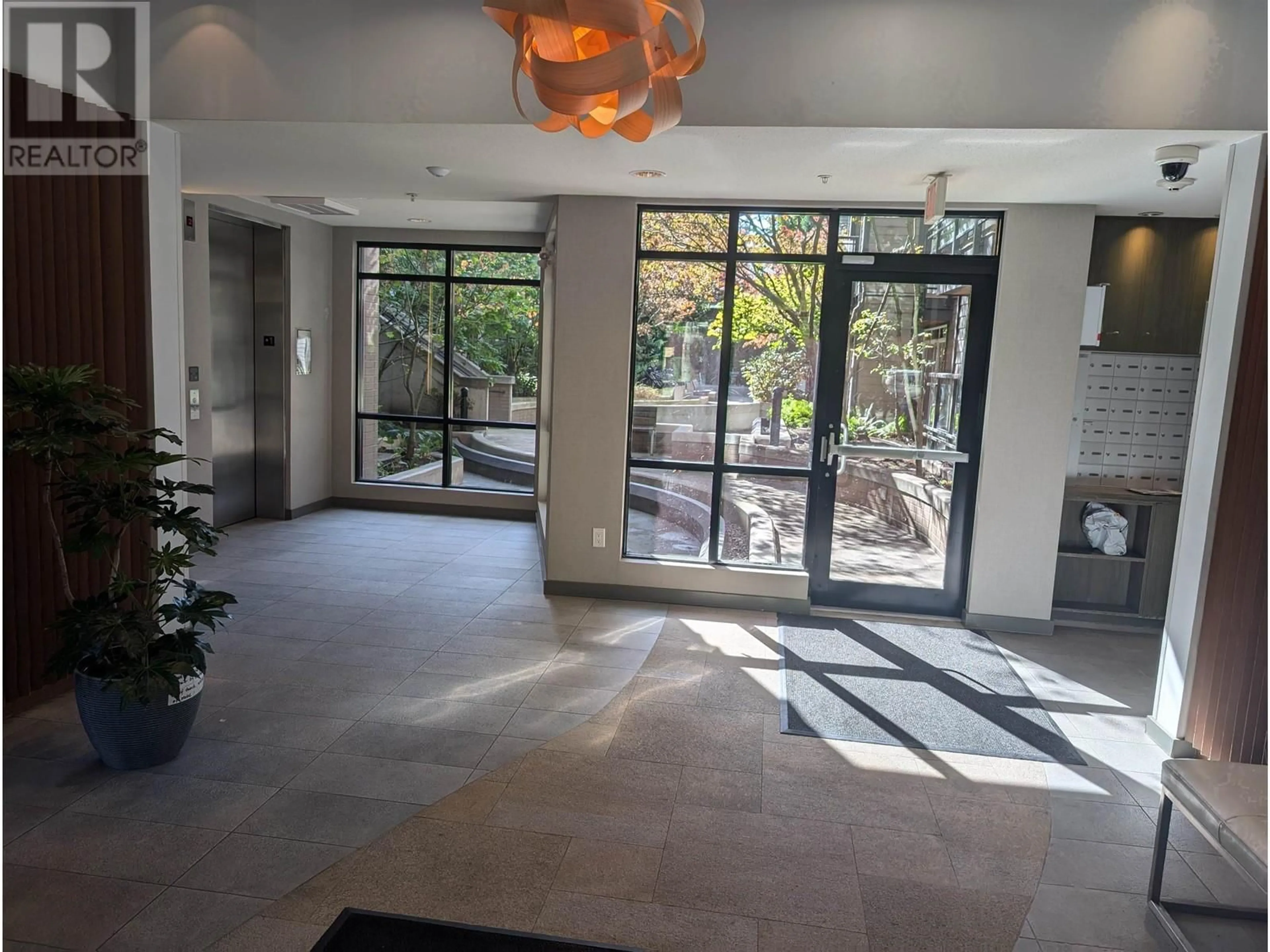 Indoor foyer, cement floor for PH13 3479 WESBROOK MALL, Vancouver British Columbia V6S0B7