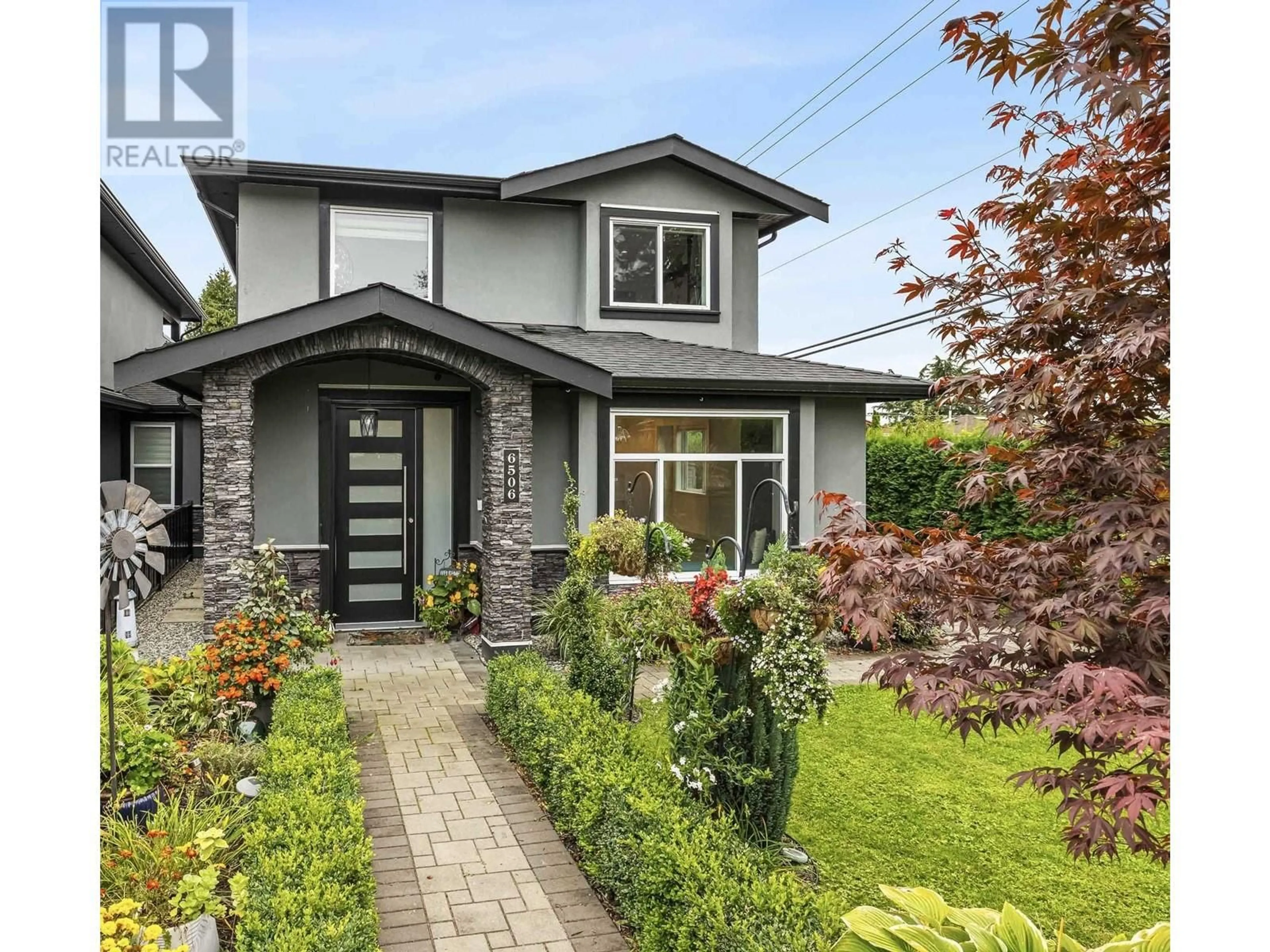 Frontside or backside of a home, the fenced backyard for 6506 KITCHENER STREET, Burnaby British Columbia V5B2J6