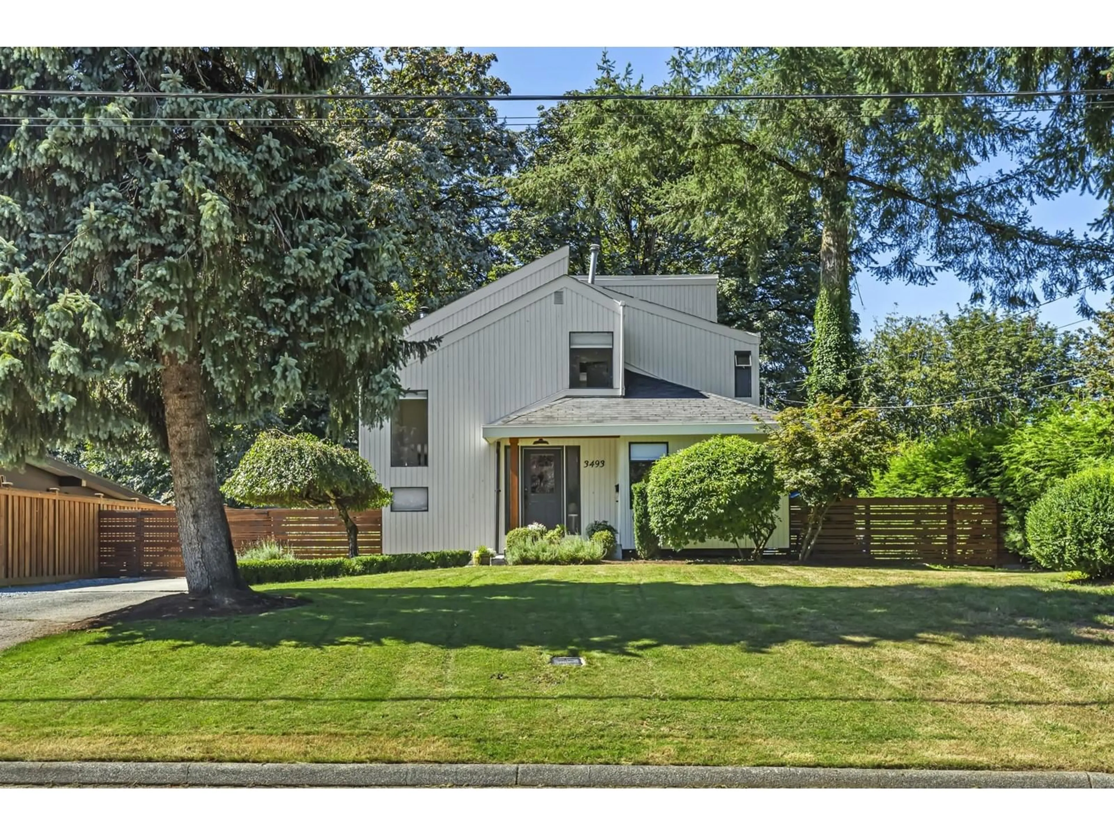 Frontside or backside of a home, the fenced backyard for 3493 PICTON STREET, Abbotsford British Columbia V2S4X9