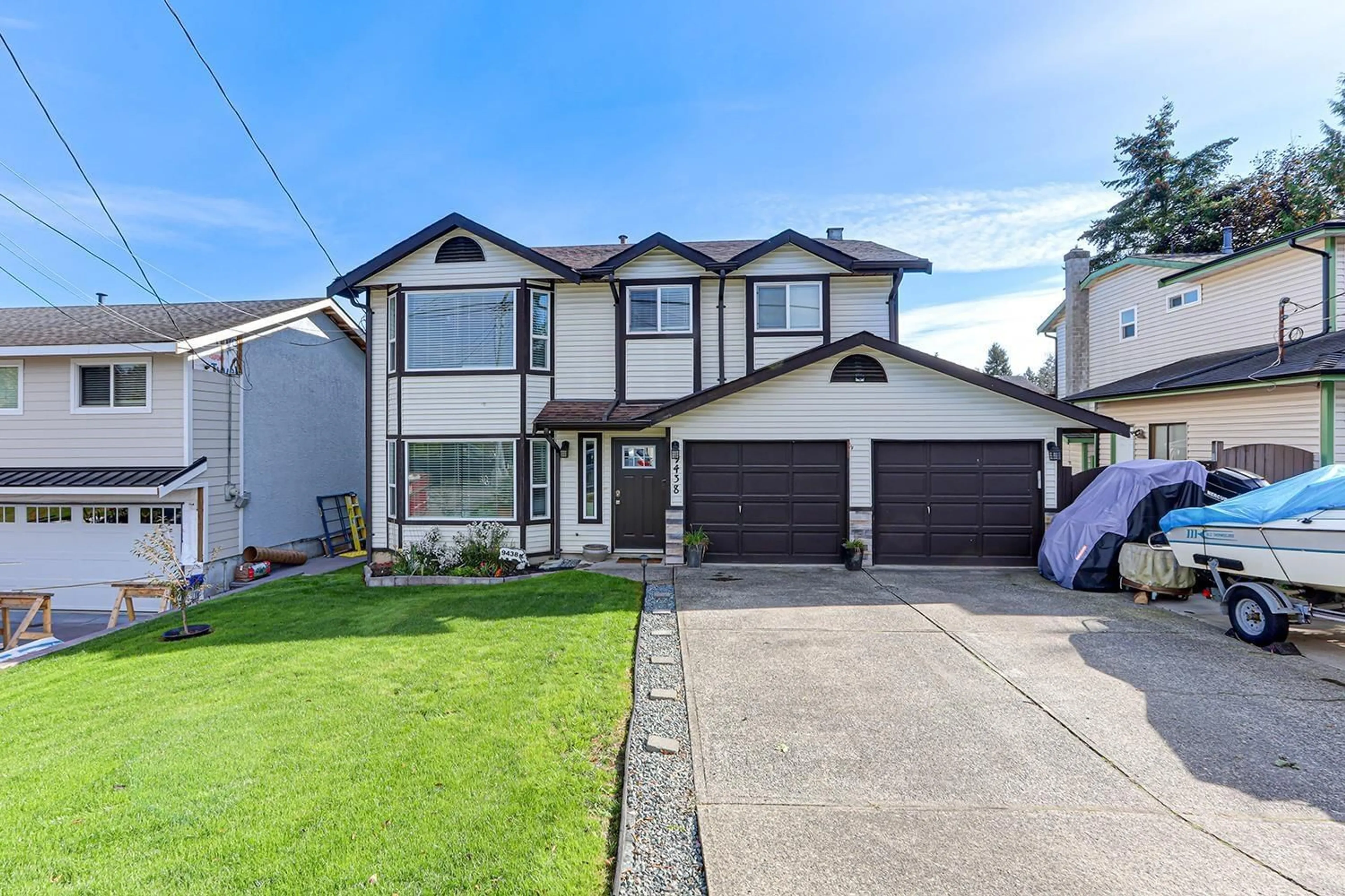 Frontside or backside of a home, the street view for 9438 213 STREET, Langley British Columbia V1M1T2