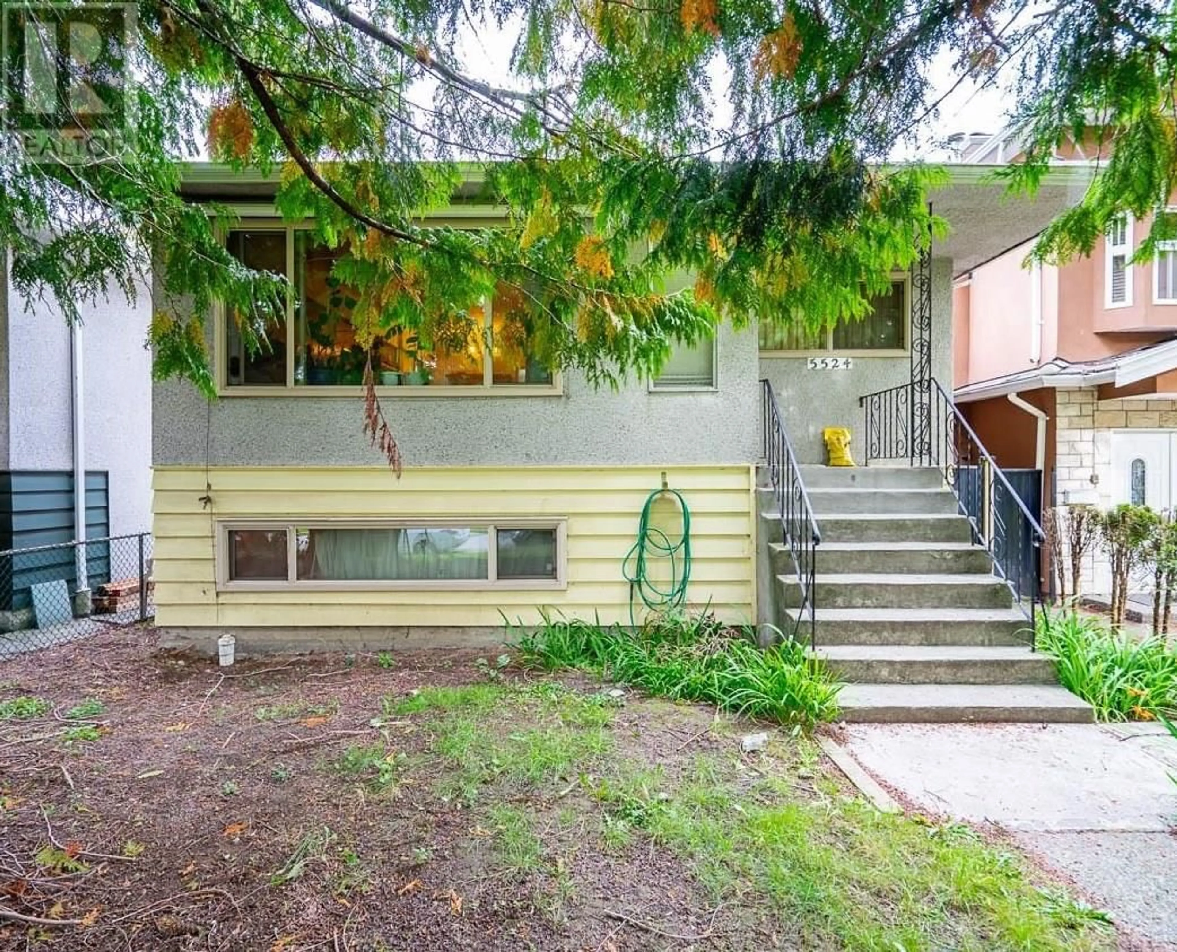 Frontside or backside of a home, the fenced backyard for 5524 EARLES STREET, Vancouver British Columbia V5R3S1