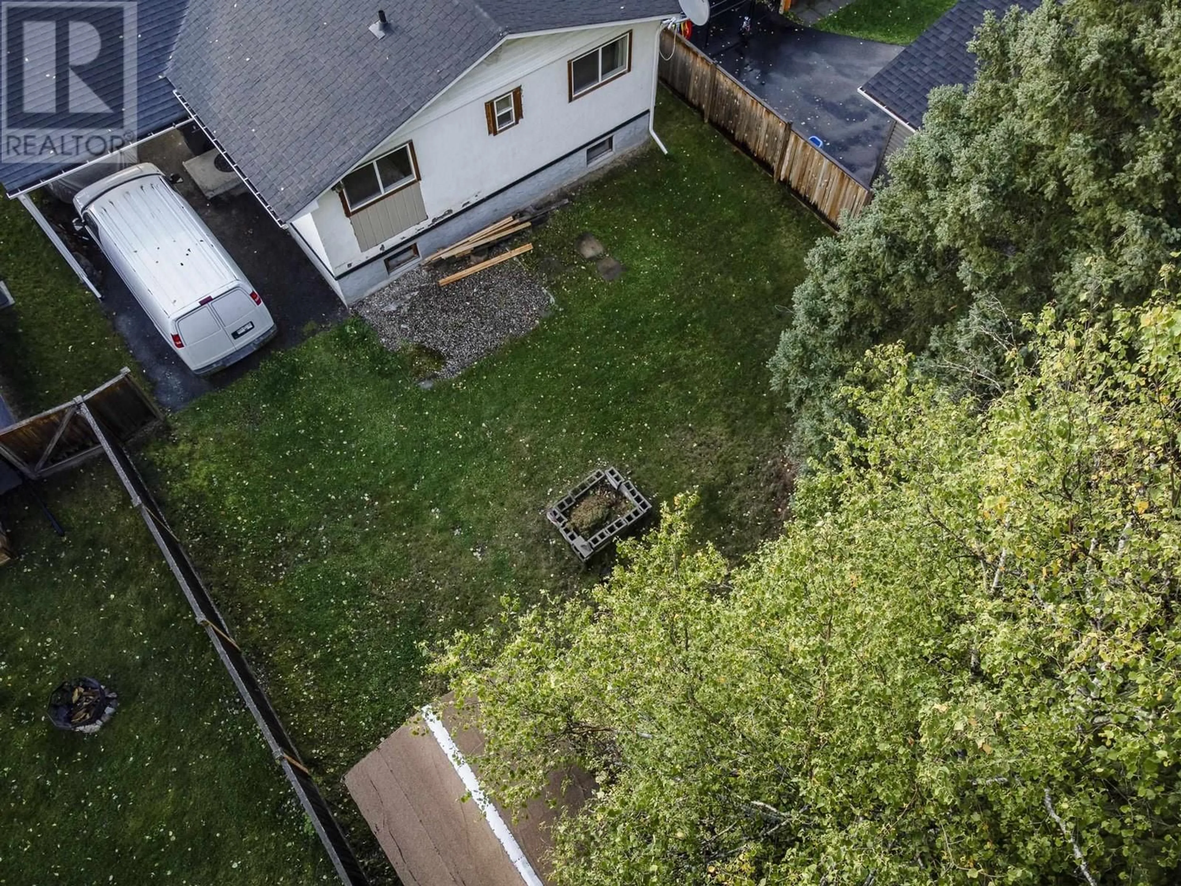 Frontside or backside of a home, the fenced backyard for 8032 PRINCETON CRESCENT, Prince George British Columbia V2N3W5