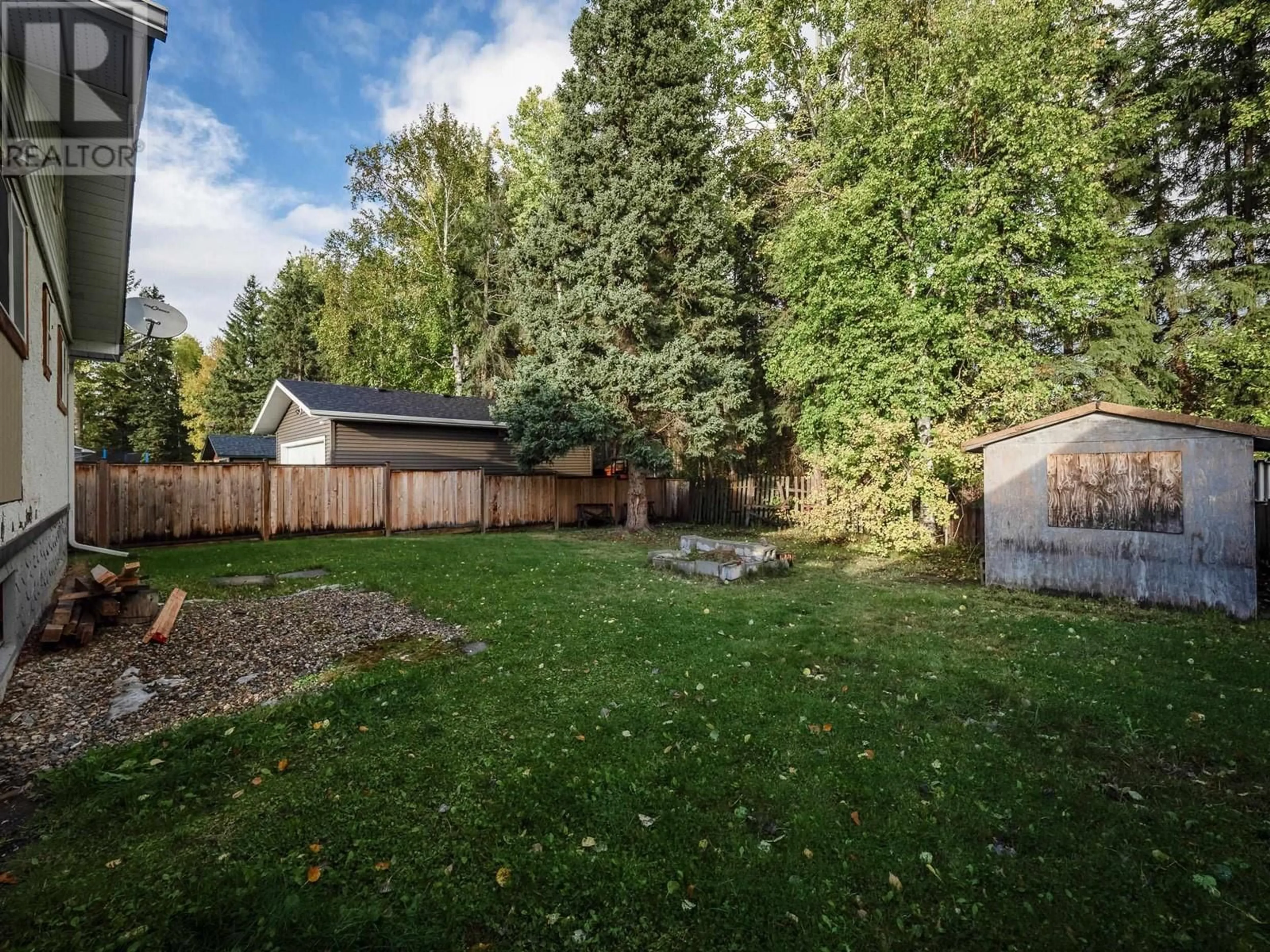 Frontside or backside of a home, the fenced backyard for 8032 PRINCETON CRESCENT, Prince George British Columbia V2N3W5