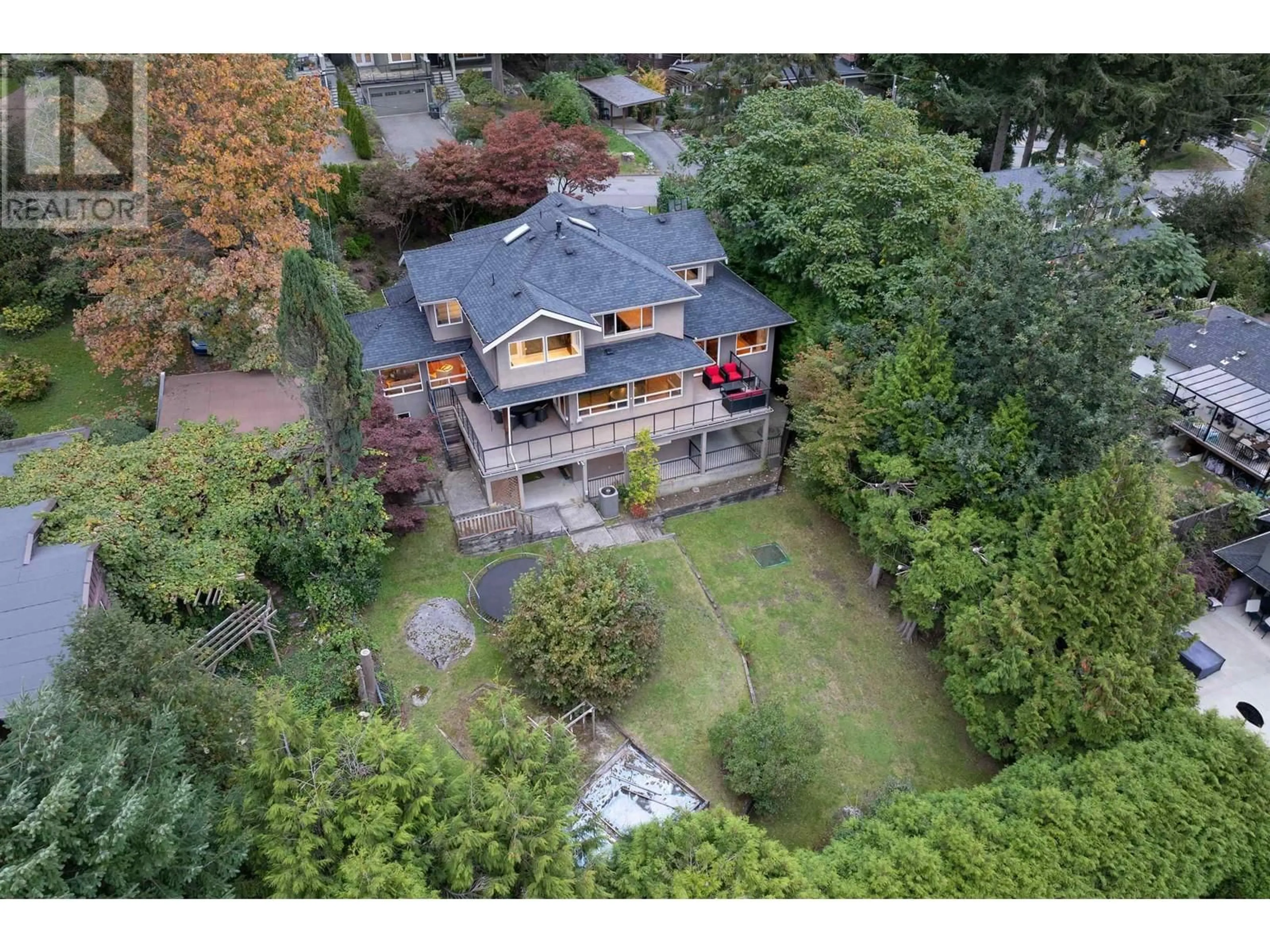 Frontside or backside of a home, the fenced backyard for 1265 MILL STREET, North Vancouver British Columbia V7K1V3