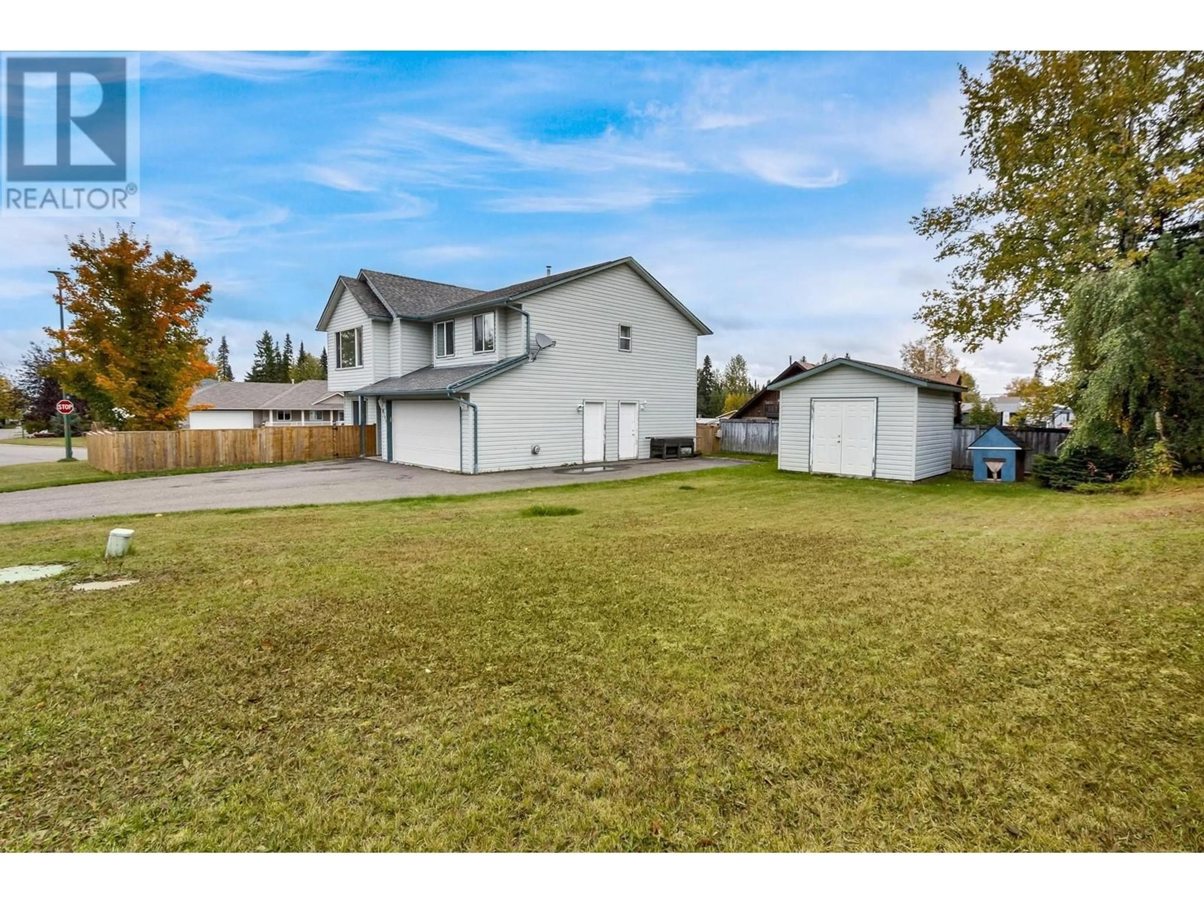 Frontside or backside of a home, the fenced backyard for 6144 BERGER PLACE, Prince George British Columbia V2K4J3