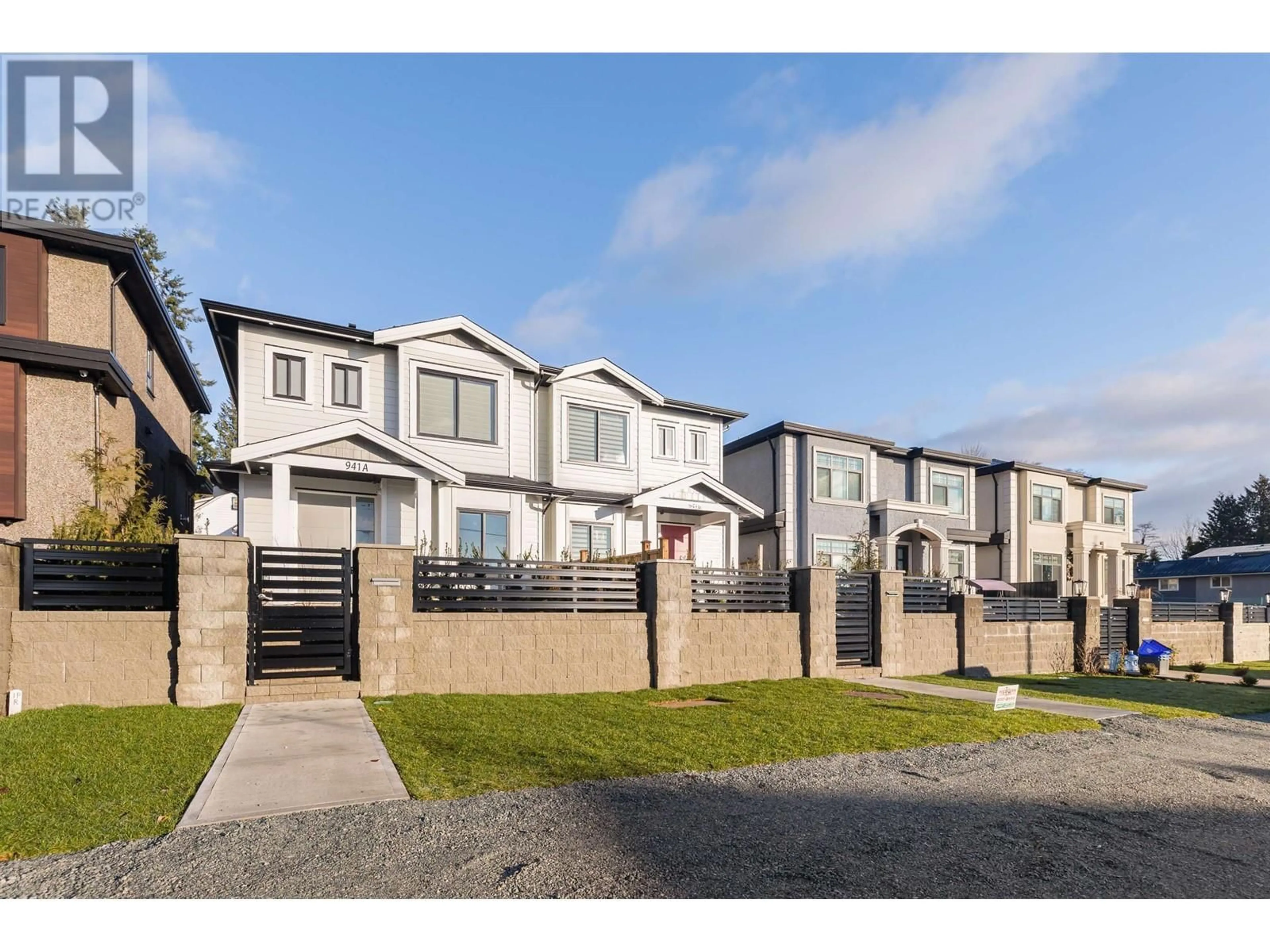 A pic from exterior of the house or condo, the fenced backyard for 941B WALLS AVENUE, Coquitlam British Columbia V3K2T2