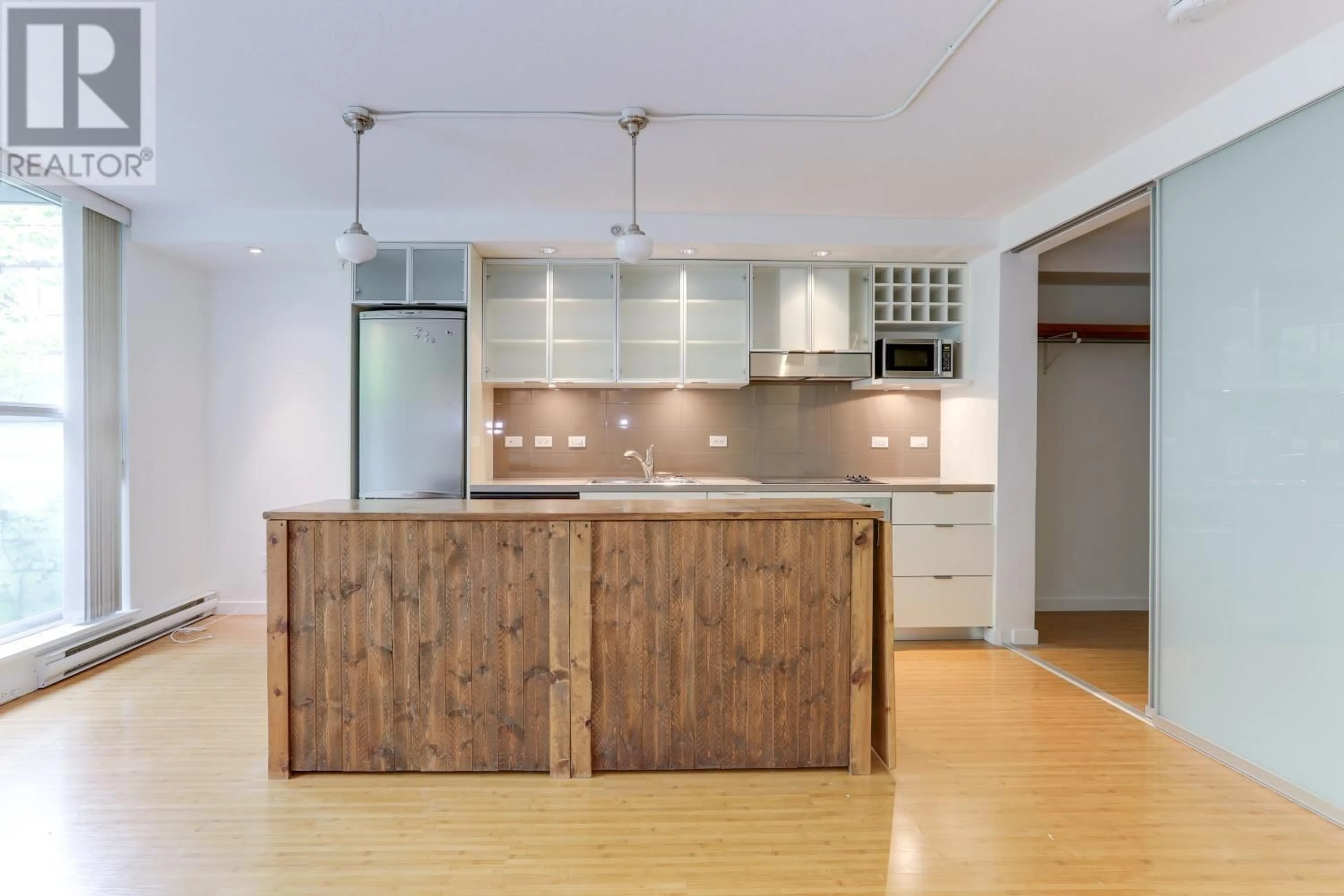 Open concept kitchen, wood/laminate floor for 302 - 168 POWELL STREET, Vancouver British Columbia V6A0B2