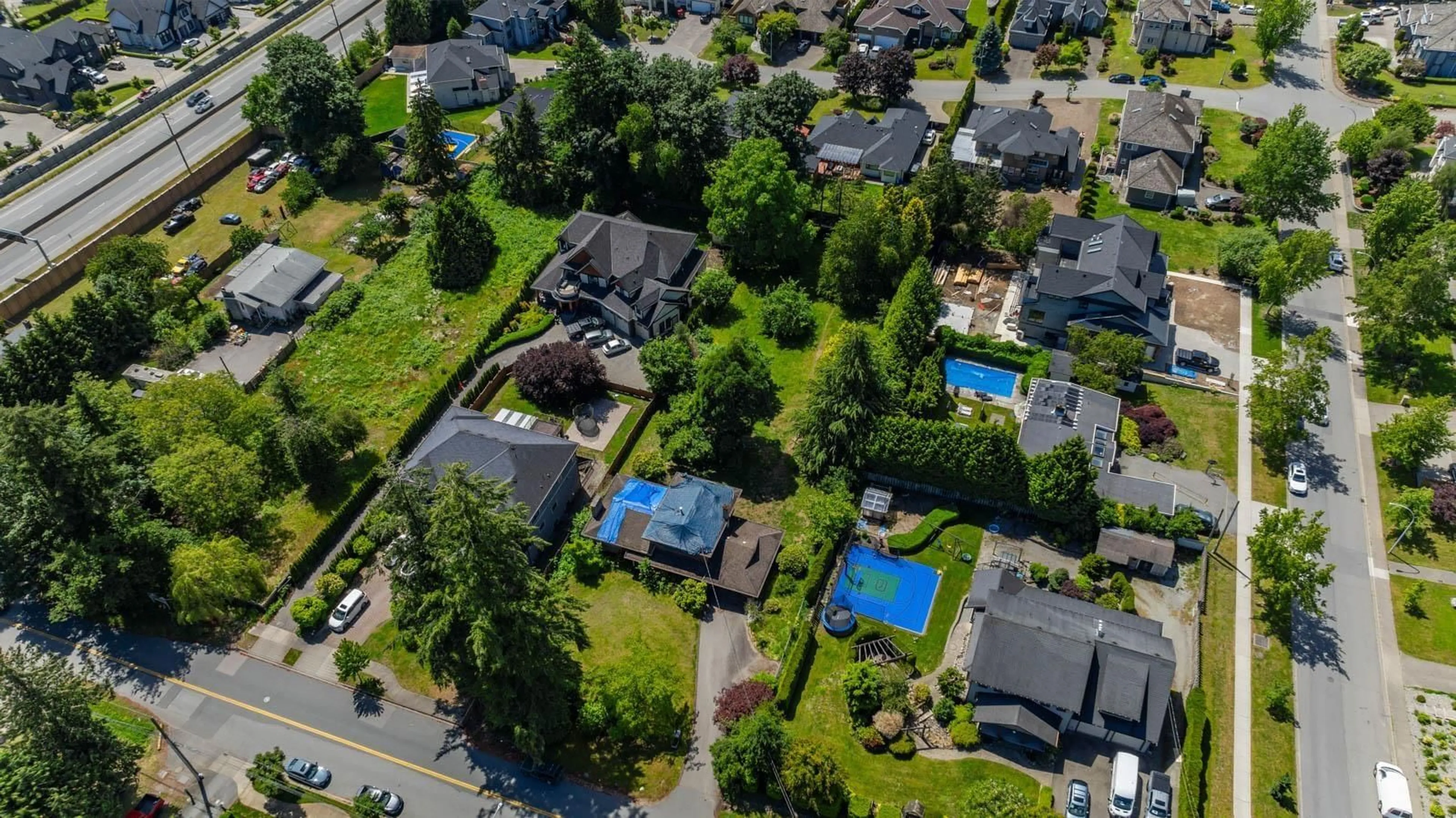 A pic from outside/outdoor area/front of a property/back of a property/a pic from drone, street for 5661 146 STREET, Surrey British Columbia V3S2Z5