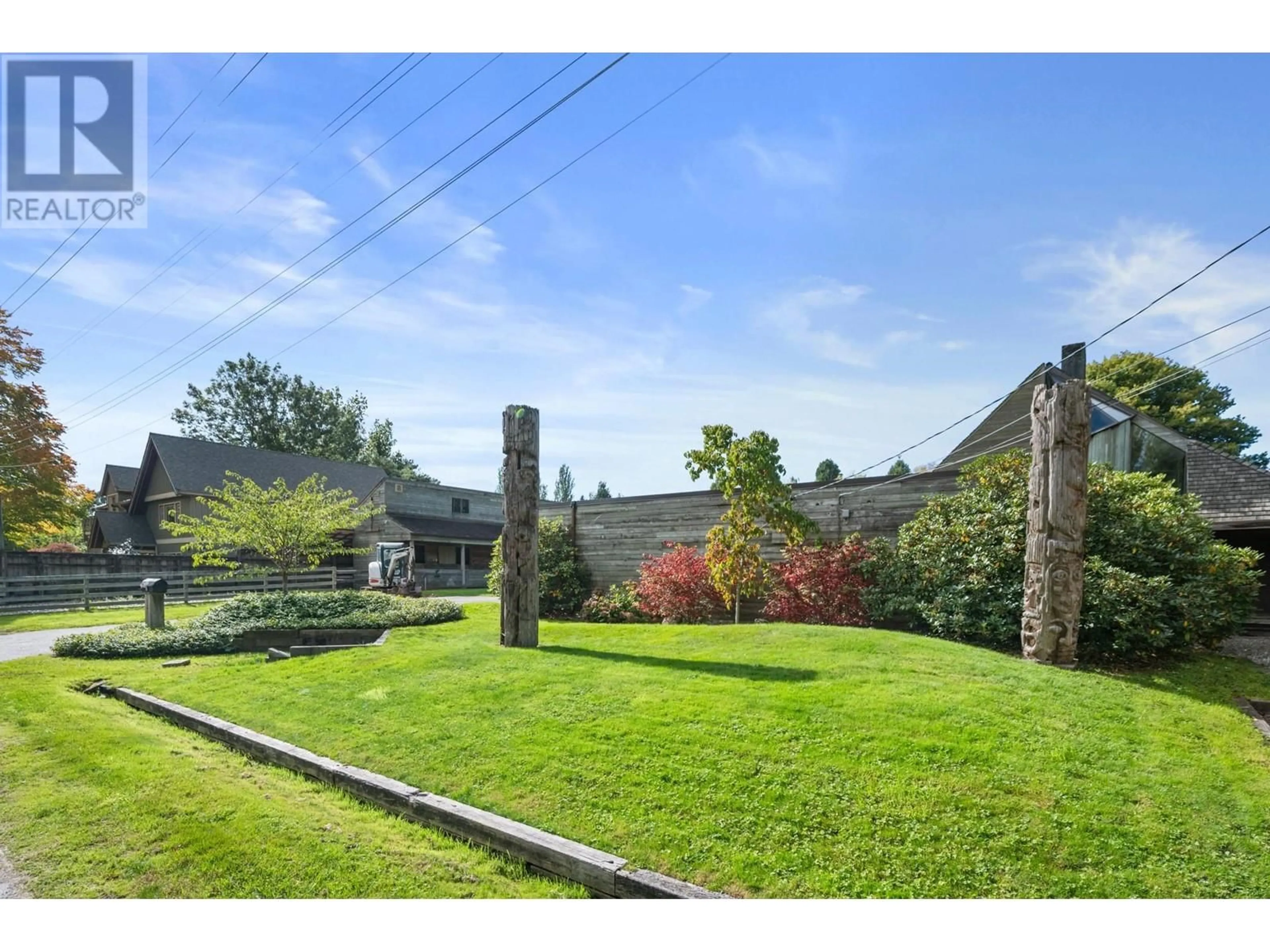 A pic from exterior of the house or condo, the fenced backyard for 7021 PRESCOTT STREET, Vancouver British Columbia V6N1N2