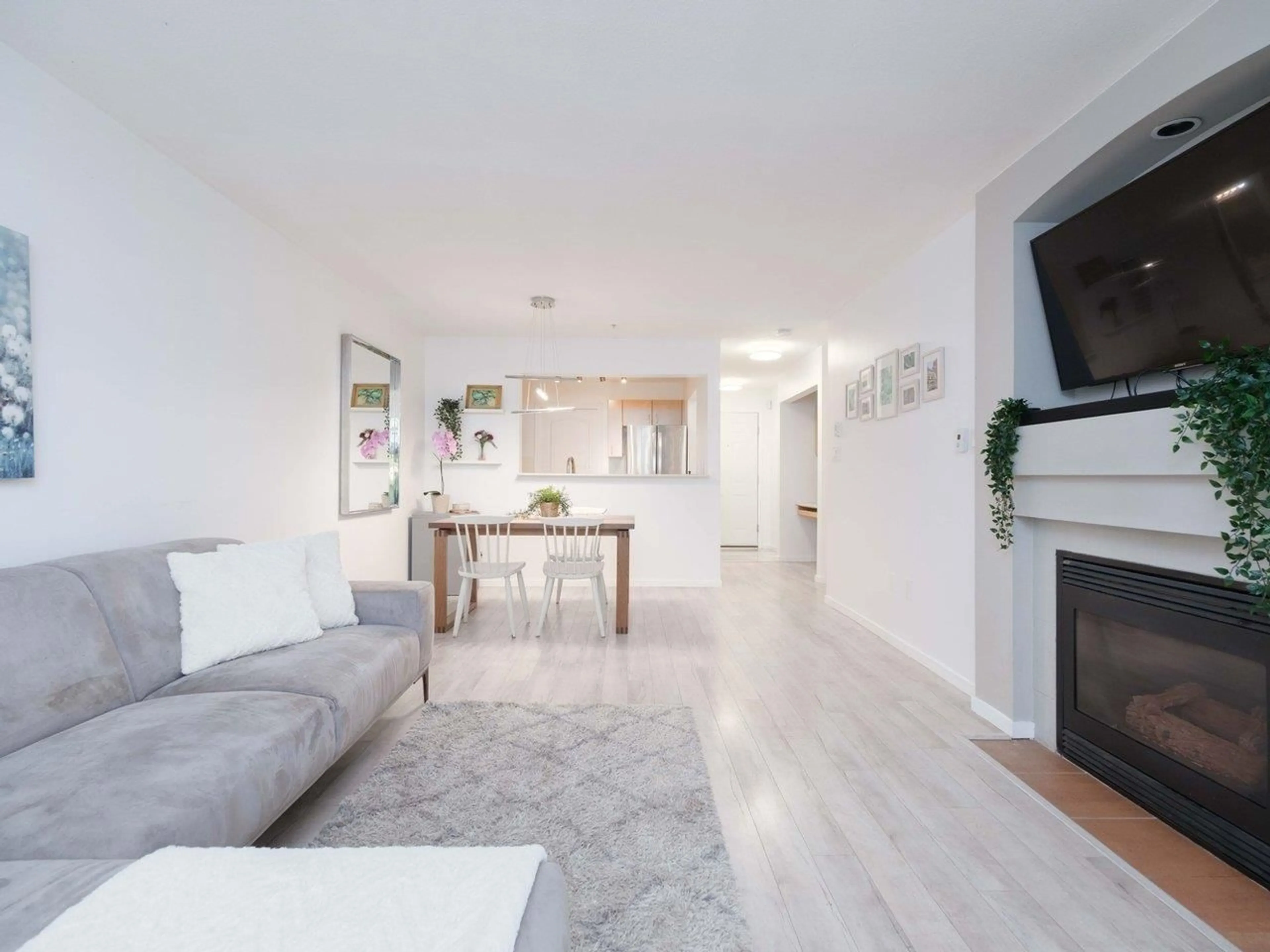 Living room, wood floors for 107 15210 GUILDFORD DRIVE, Surrey British Columbia V3R0X7