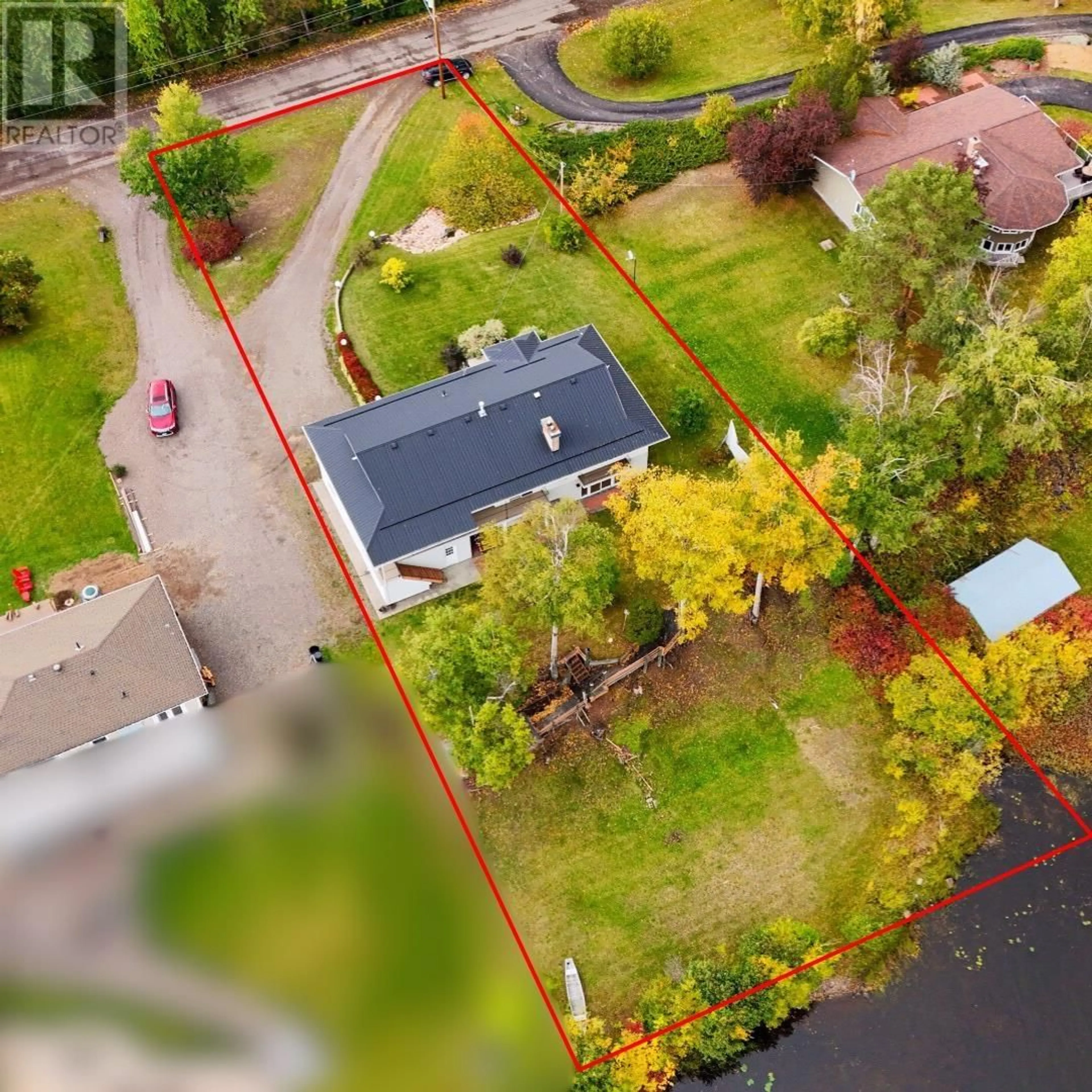 Frontside or backside of a home, the fenced backyard for 2260 GEROW ISLAND ROAD, Burns Lake British Columbia V0J1E2