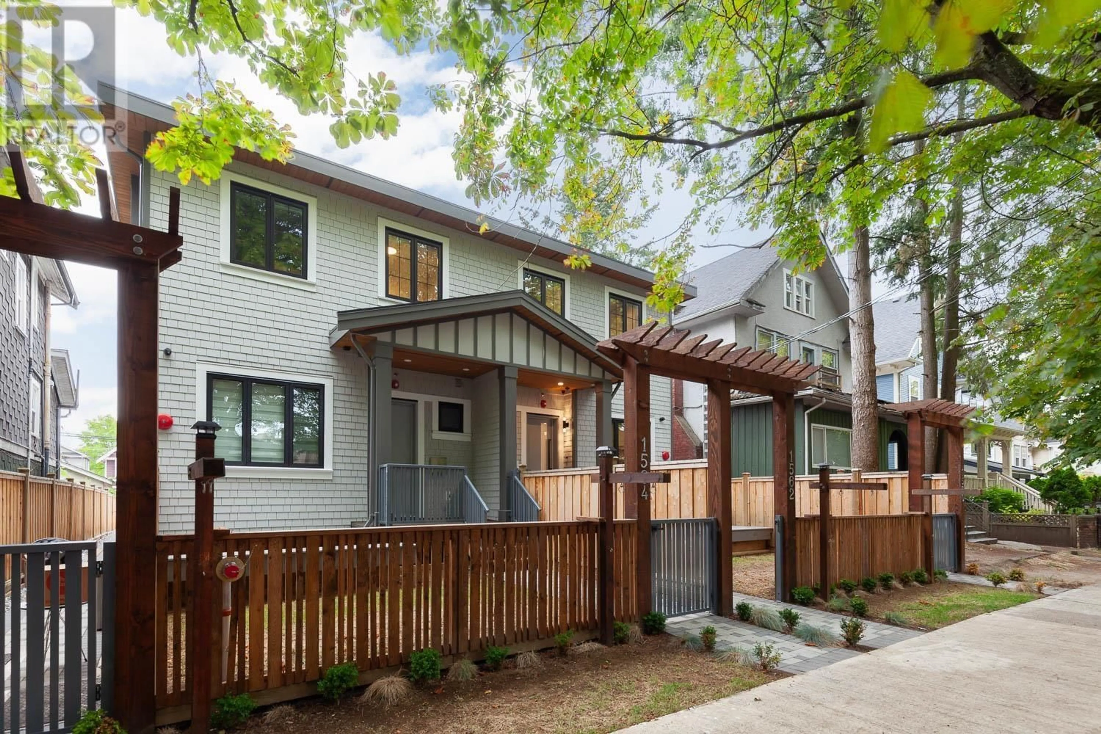 Frontside or backside of a home, the fenced backyard for 1564 E 10TH AVENUE, Vancouver British Columbia V5N1X5