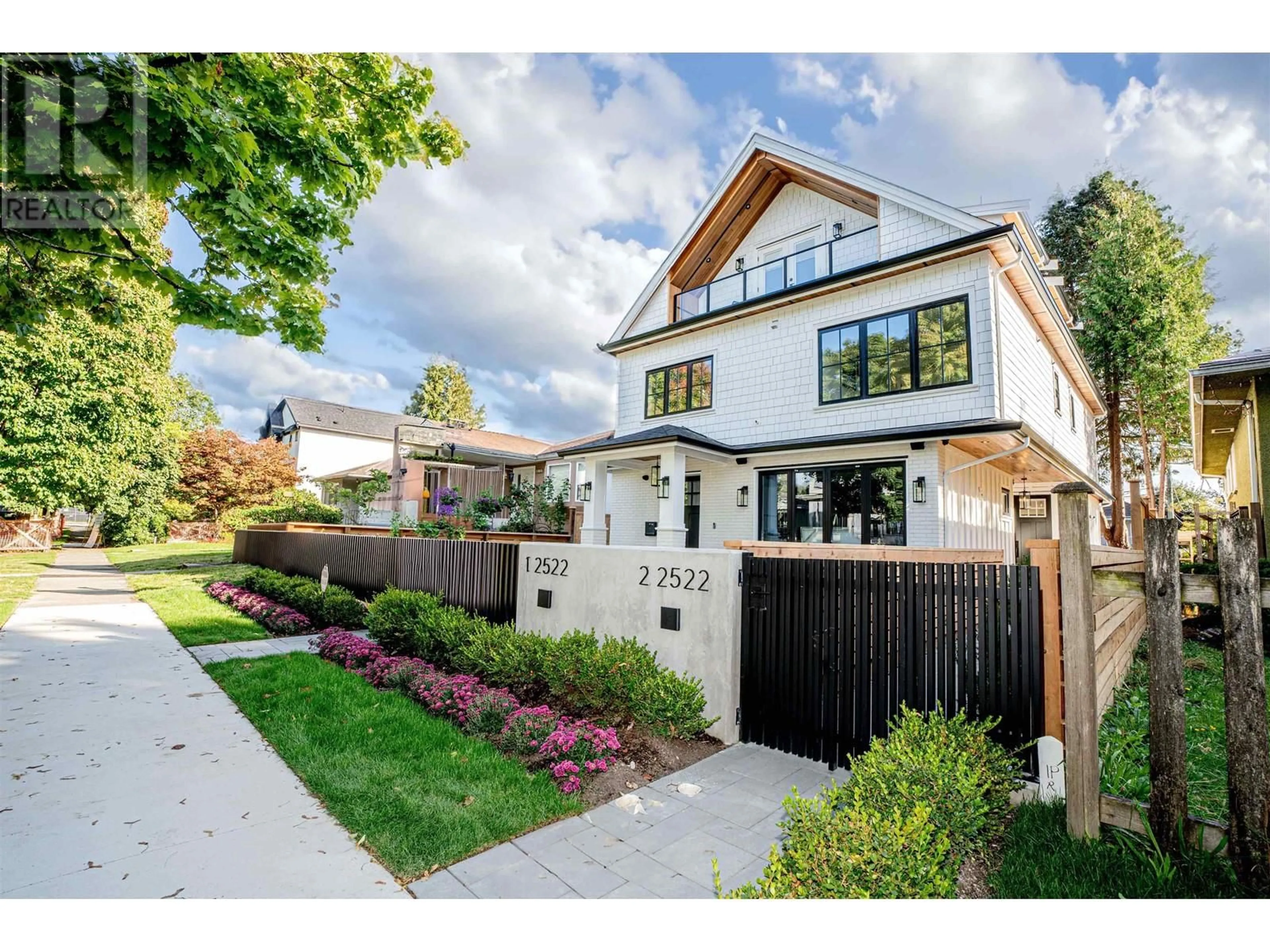 Frontside or backside of a home, the fenced backyard for #2 2522 E 15TH AVENUE, Vancouver British Columbia V5M2K1