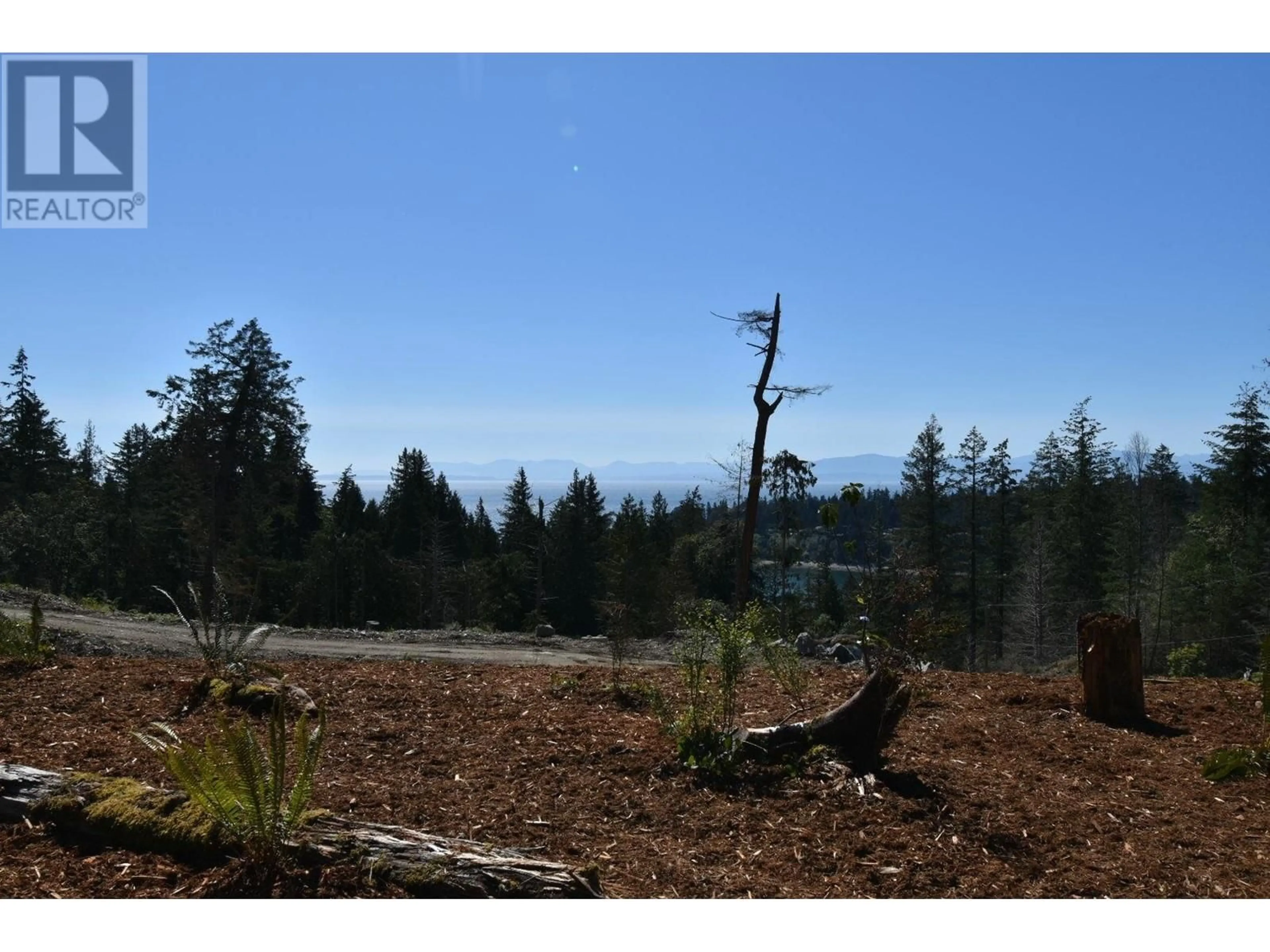 A pic from exterior of the house or condo, the fenced backyard for 5782 SARGEANT BAY HEIGHTS ROAD, Halfmoon Bay British Columbia V7Z1C3