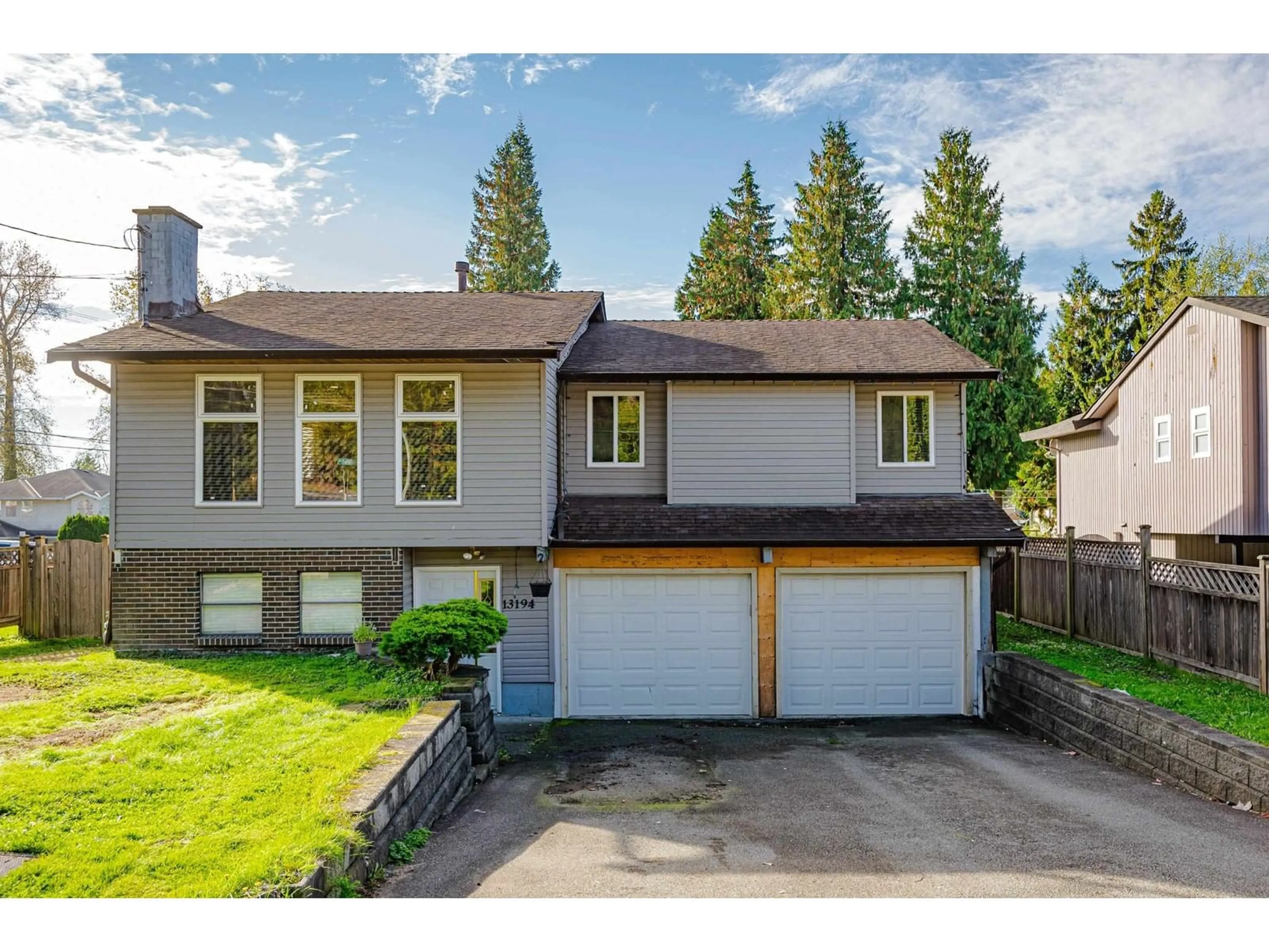 Frontside or backside of a home, the fenced backyard for 13194 98A AVENUE, Surrey British Columbia V3T1C6