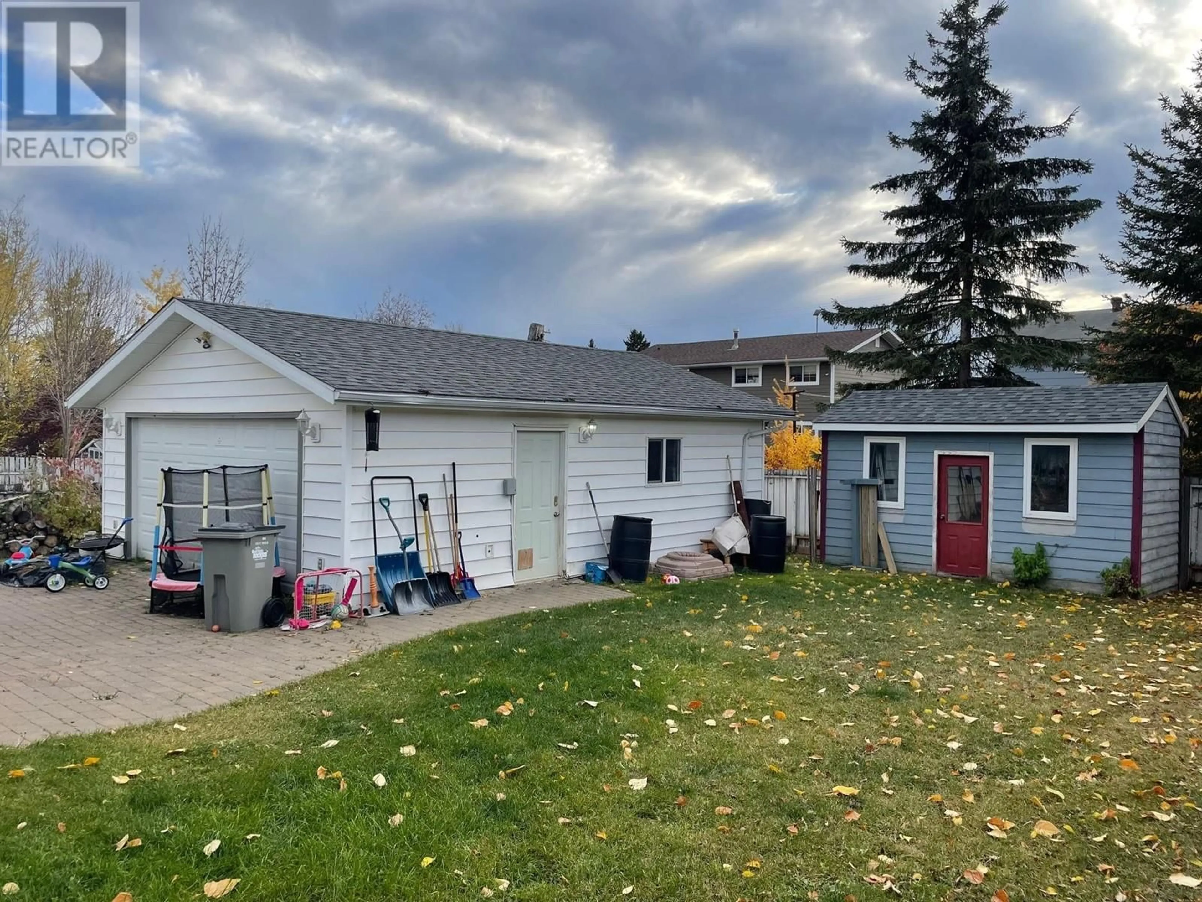 Frontside or backside of a home, the fenced backyard for 4711 SPRUCE AVENUE, Fort Nelson British Columbia V0C1R0