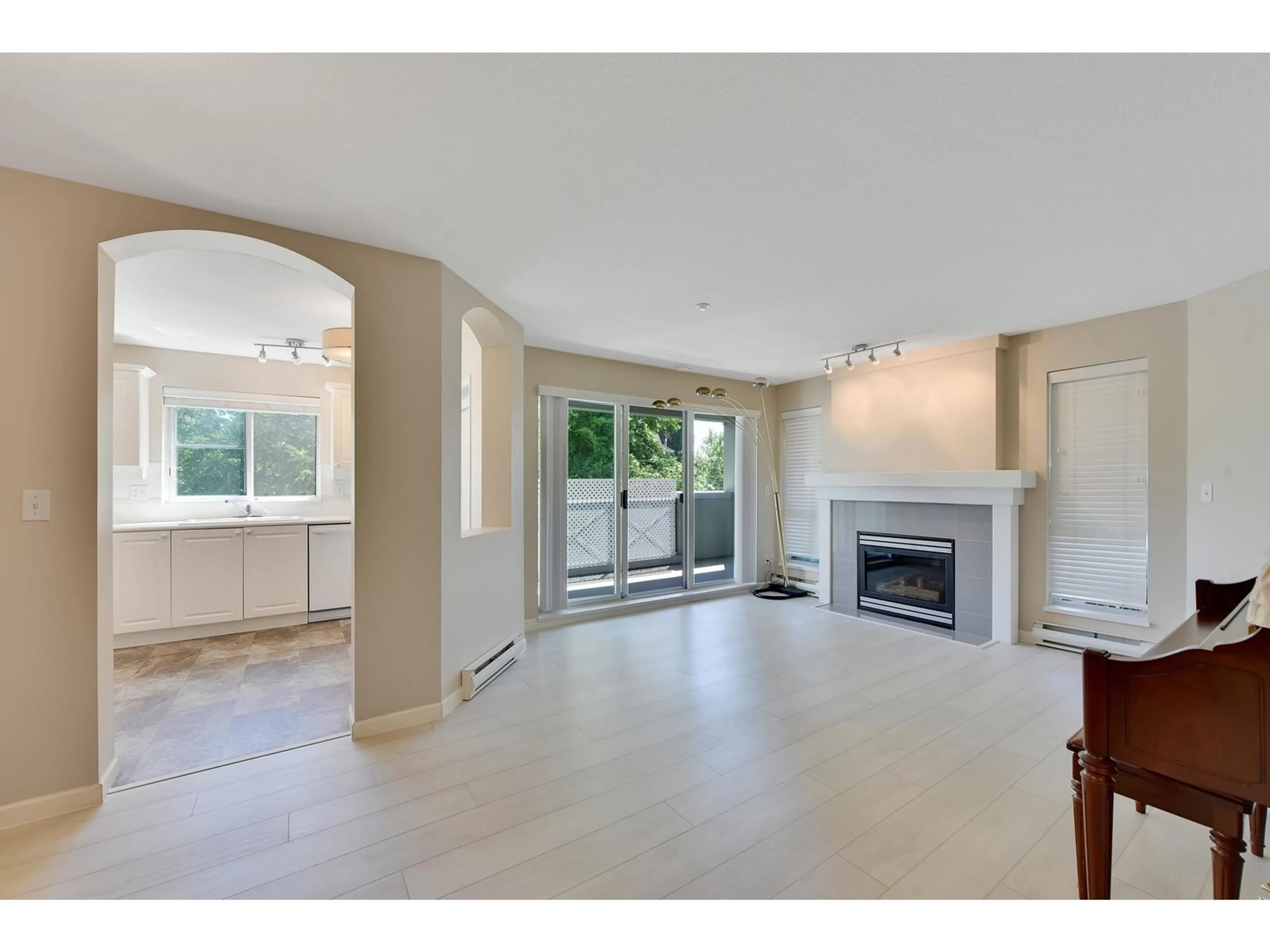 A pic of a room, wood floors for 302 20110 MICHAUD CRESCENT, Langley British Columbia V3A4B1