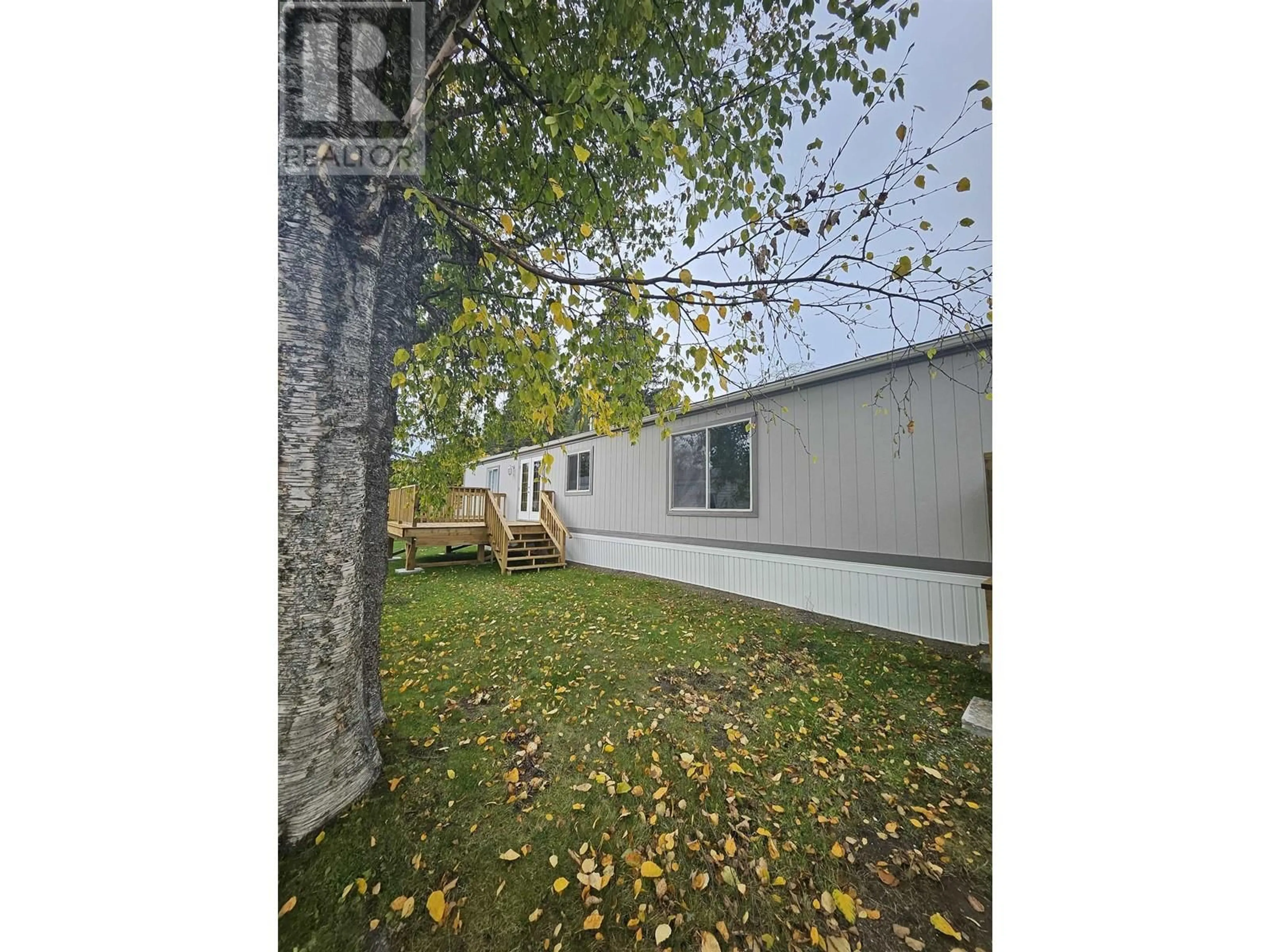 A pic from exterior of the house or condo, the fenced backyard for 23 654 NORTH FRASER DRIVE, Quesnel British Columbia V2J1Z6