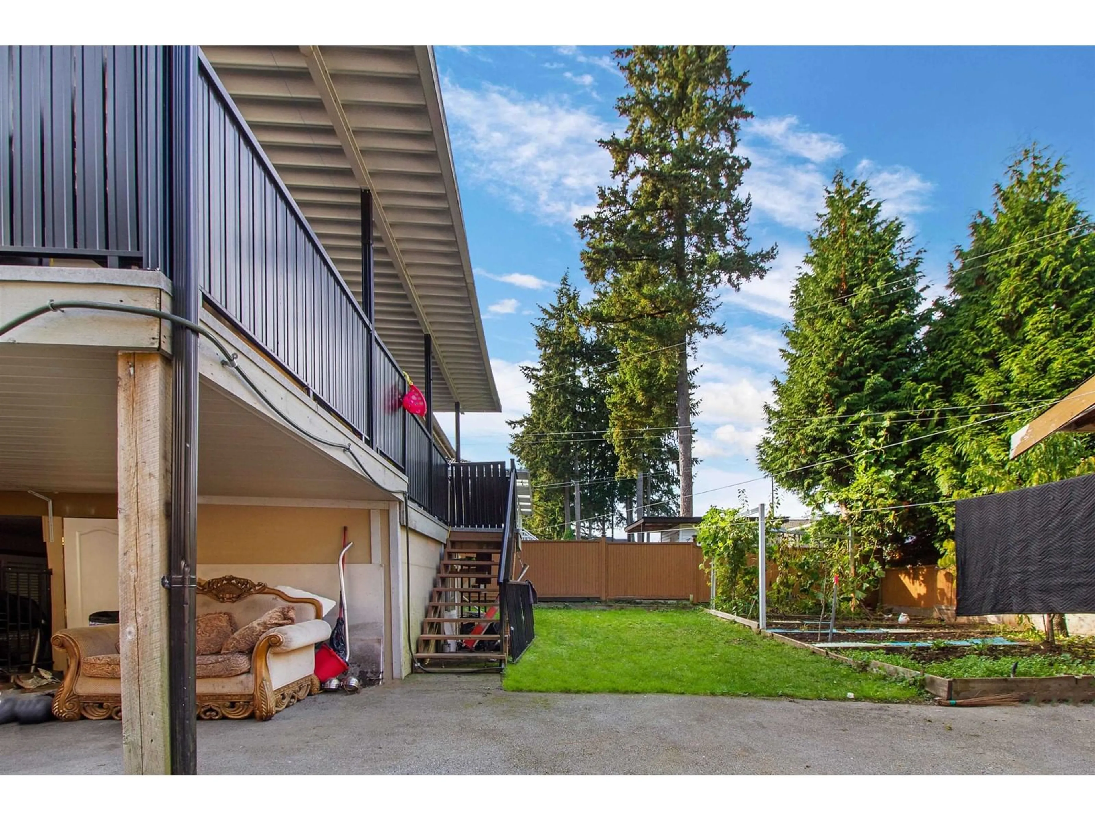 Frontside or backside of a home, the fenced backyard for 13661 60 AVENUE, Surrey British Columbia V3X2M7