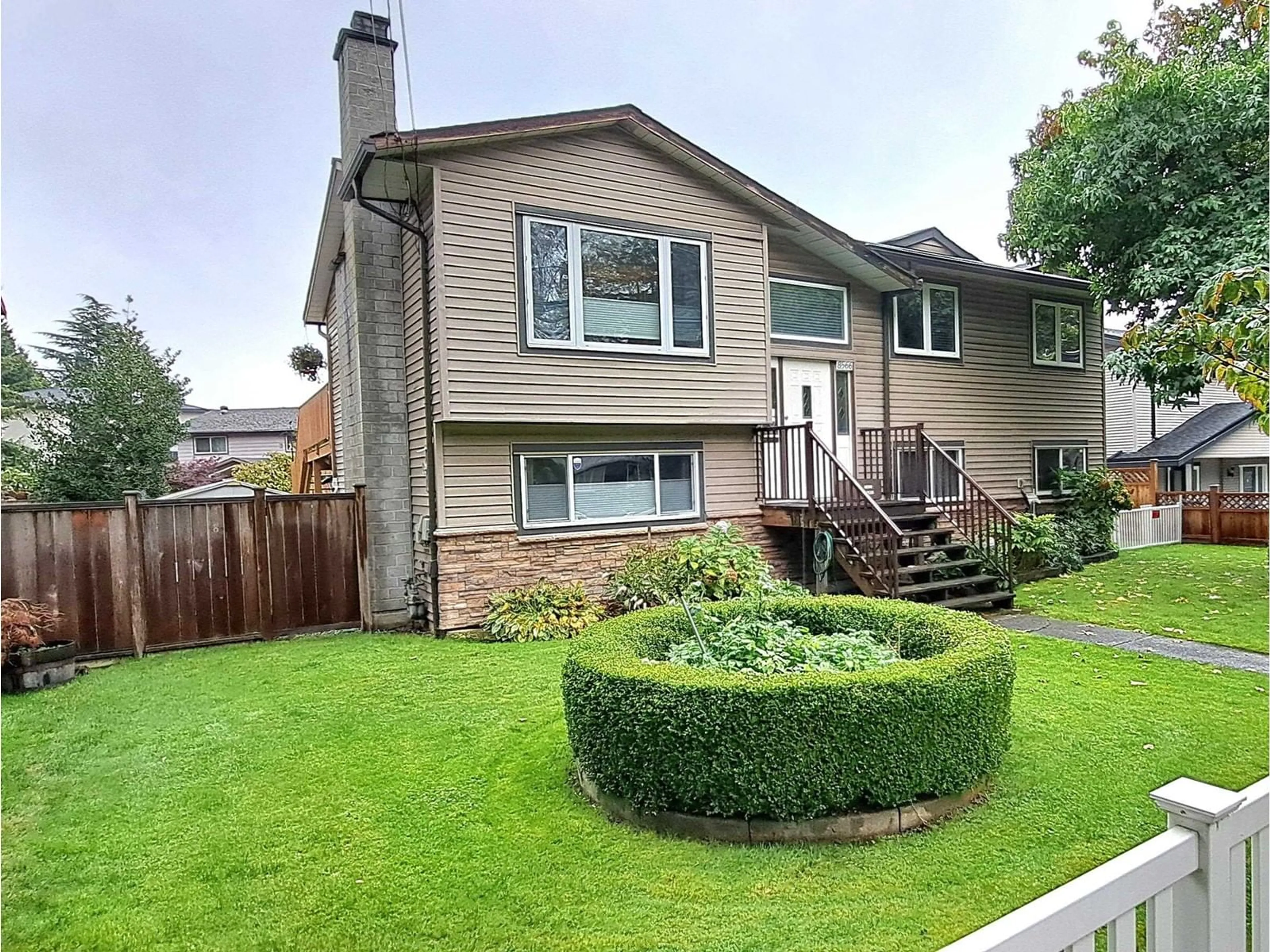 Frontside or backside of a home, the fenced backyard for 8566 144 STREET, Surrey British Columbia V3W5T7