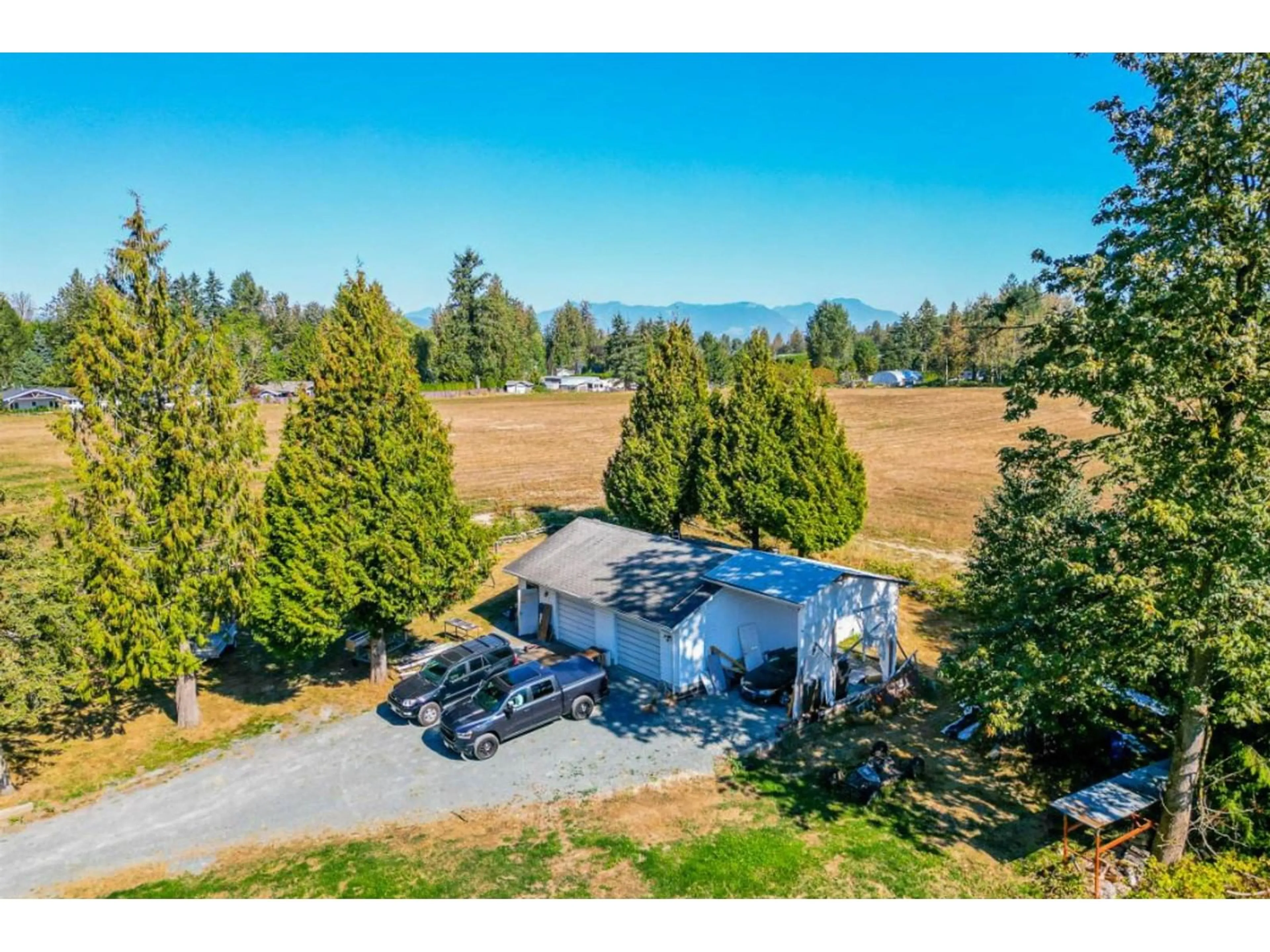 Frontside or backside of a home, the fenced backyard for 30213 DOWNES ROAD, Abbotsford British Columbia V4X1Z8