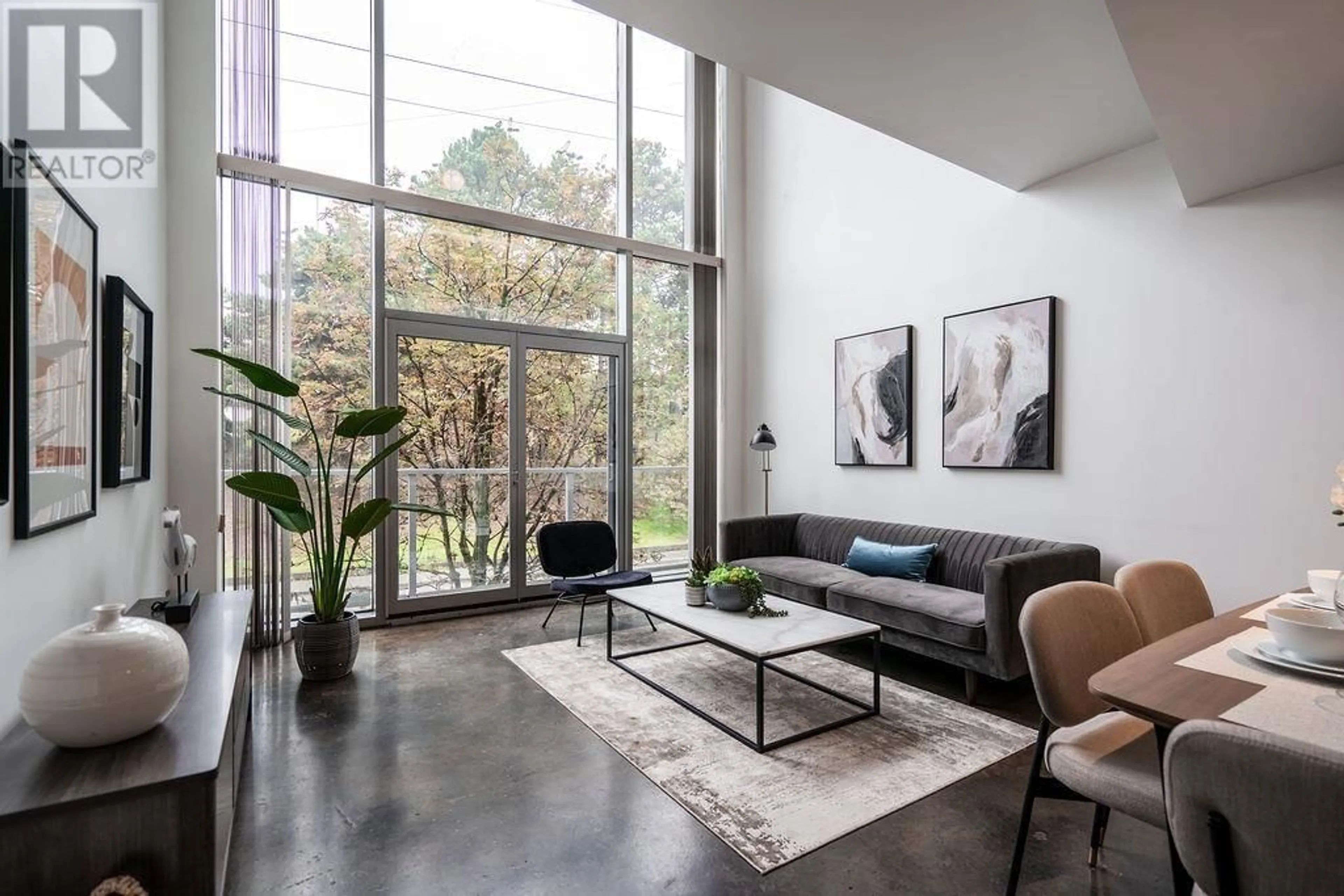 Living room, cement floor for 204 919 STATION STREET, Vancouver British Columbia V6A4L9