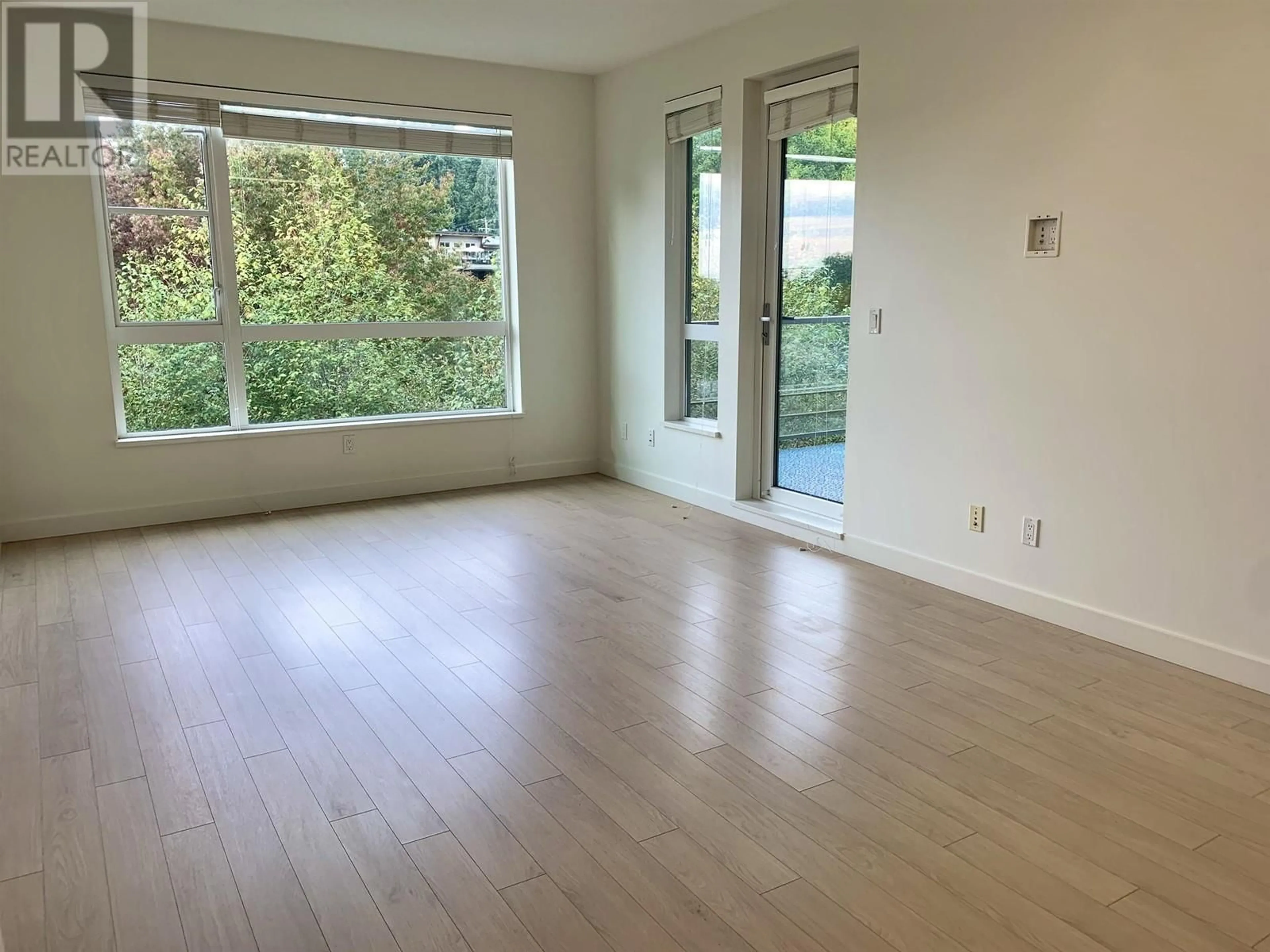 A pic of a room, wood floors for 307 1621 HAMILTON AVENUE, North Vancouver British Columbia V7P0B6