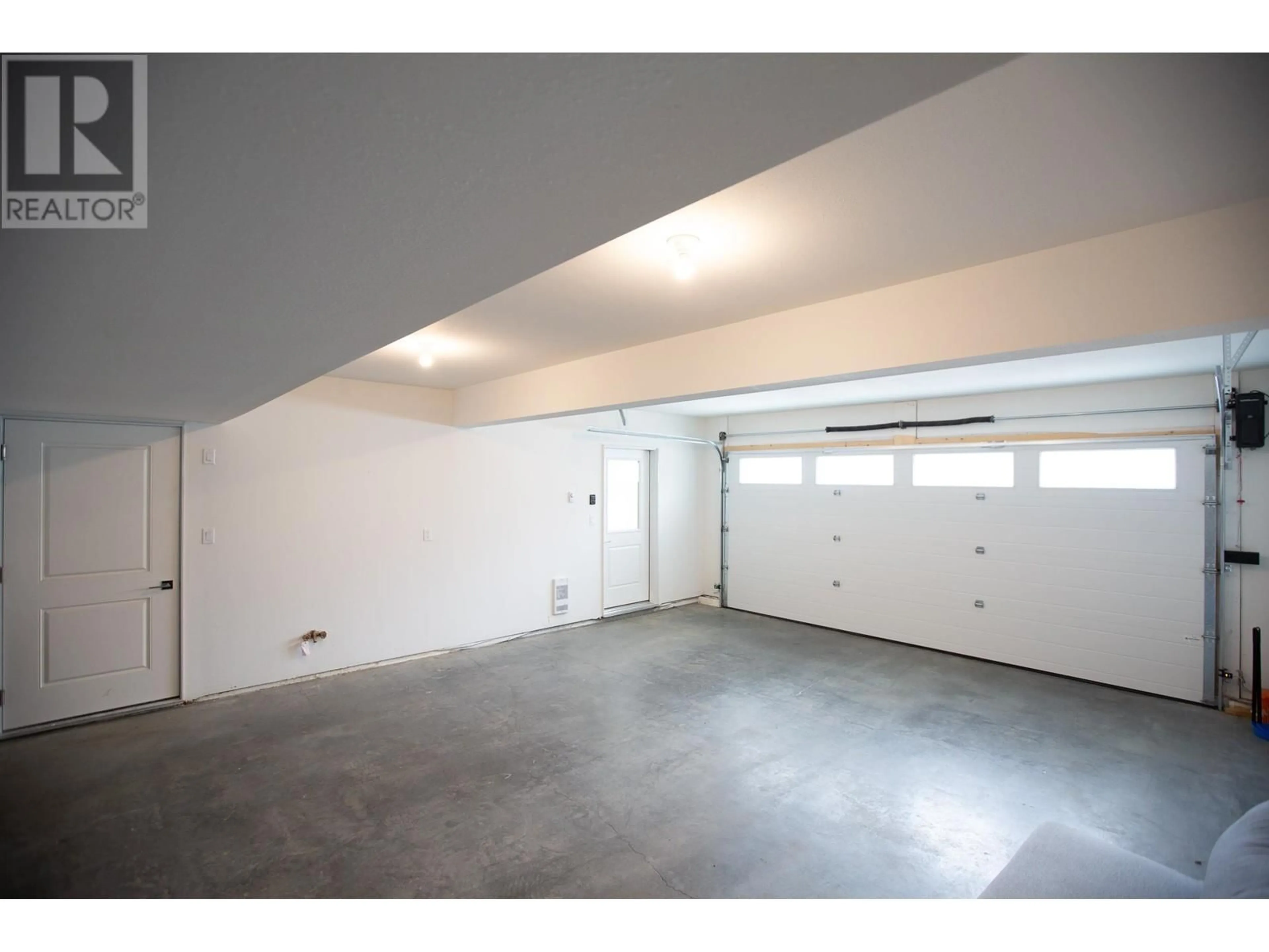 Indoor garage, cement floor for 407 4274 22ND AVENUE, Prince George British Columbia V2N0J4