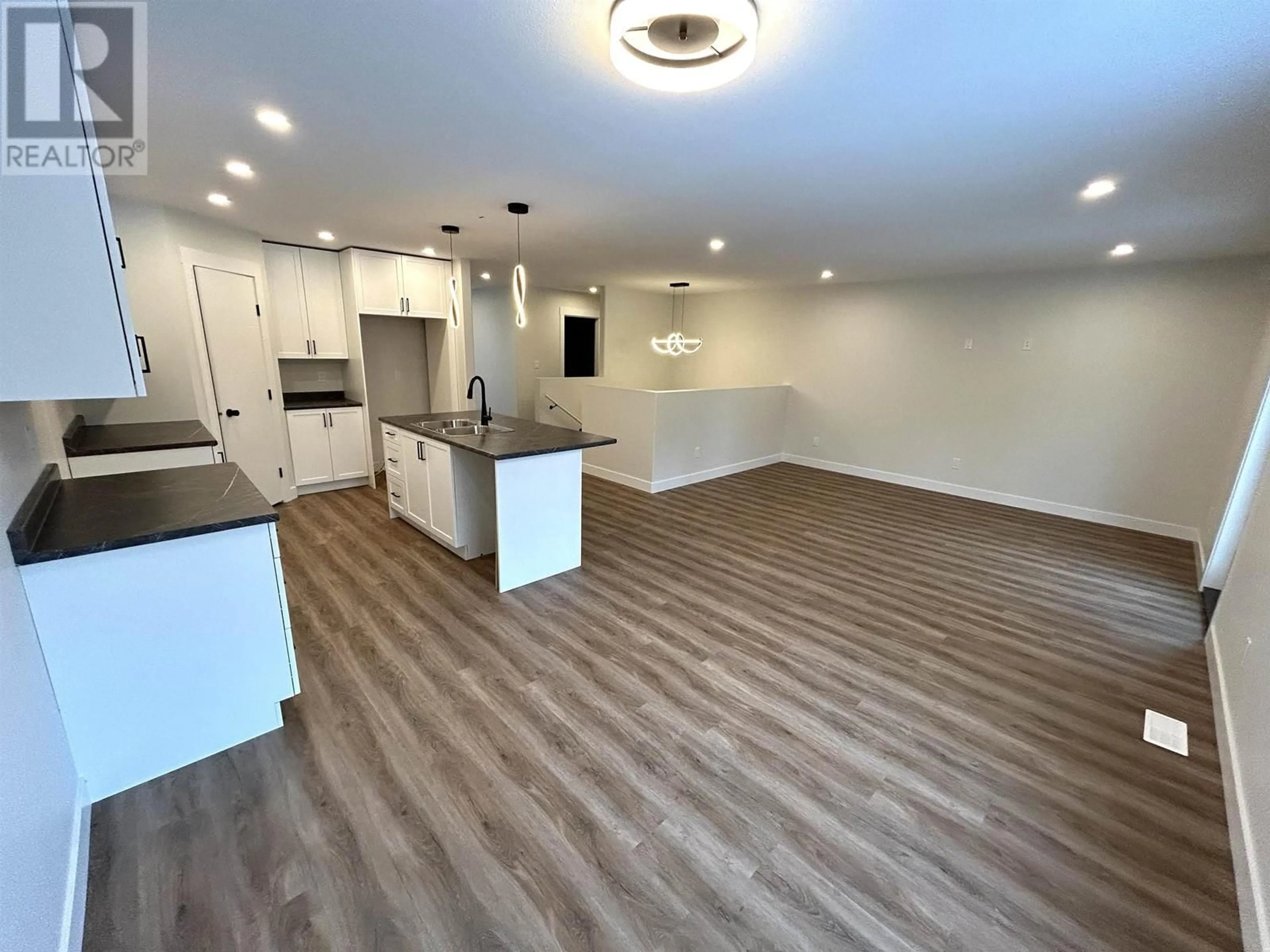 Open concept kitchen, wood/laminate floor for 5452 W VENTA DRIVE, Prince George British Columbia V2K0B6