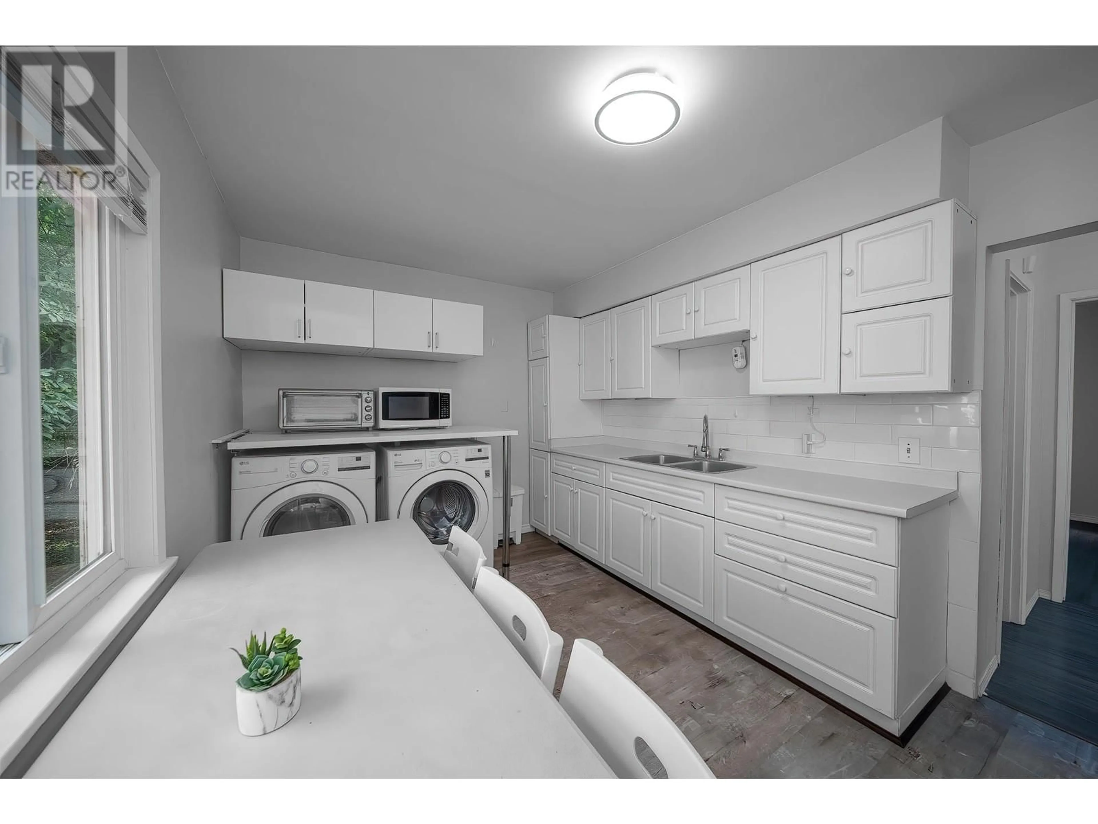 Kitchen with laundary machines for 1150 E 21ST AVENUE, Vancouver British Columbia V5V1S8