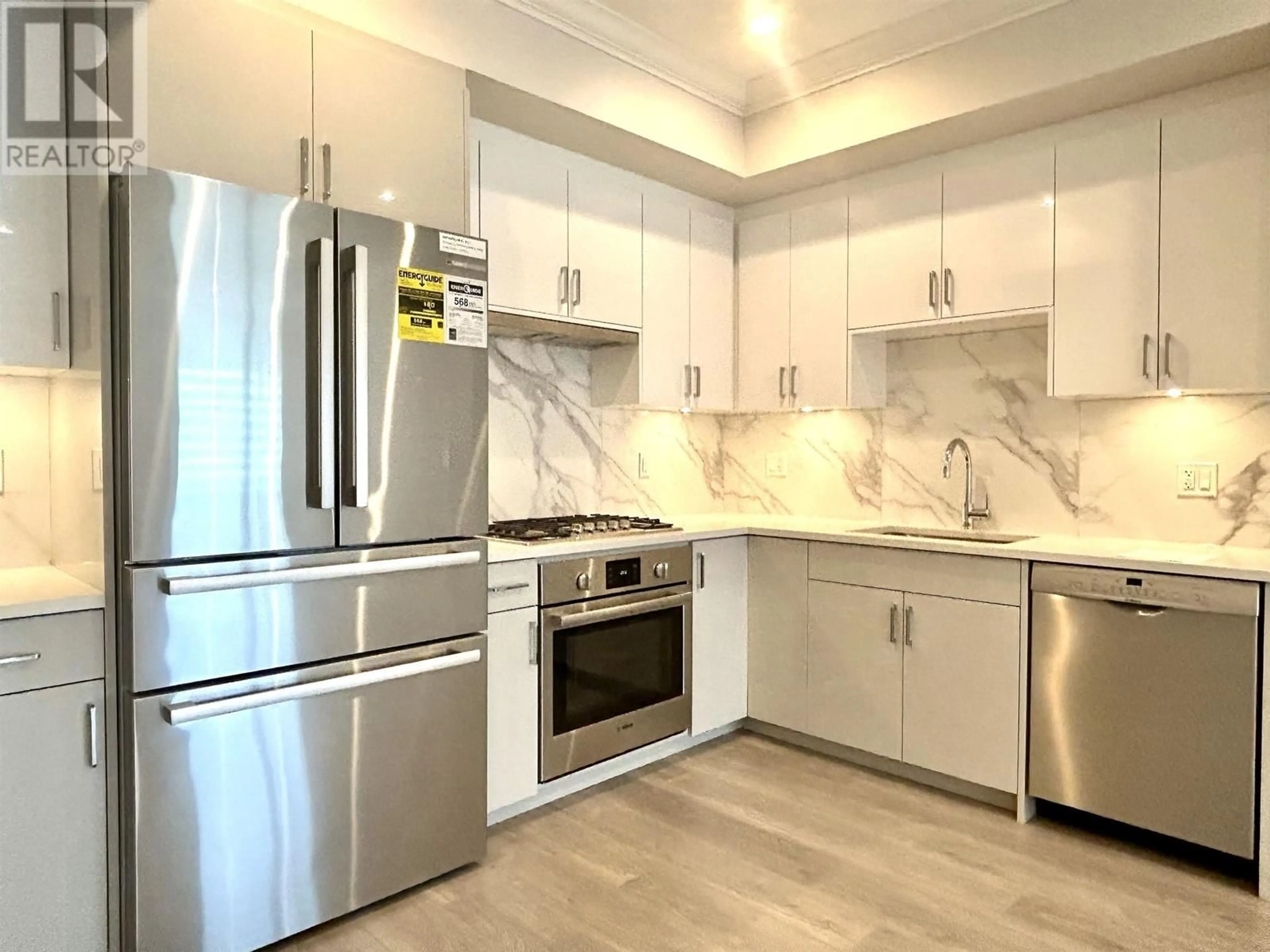 Contemporary kitchen, wood floors for 36 7567 OAK STREET, Vancouver British Columbia V6P4A4