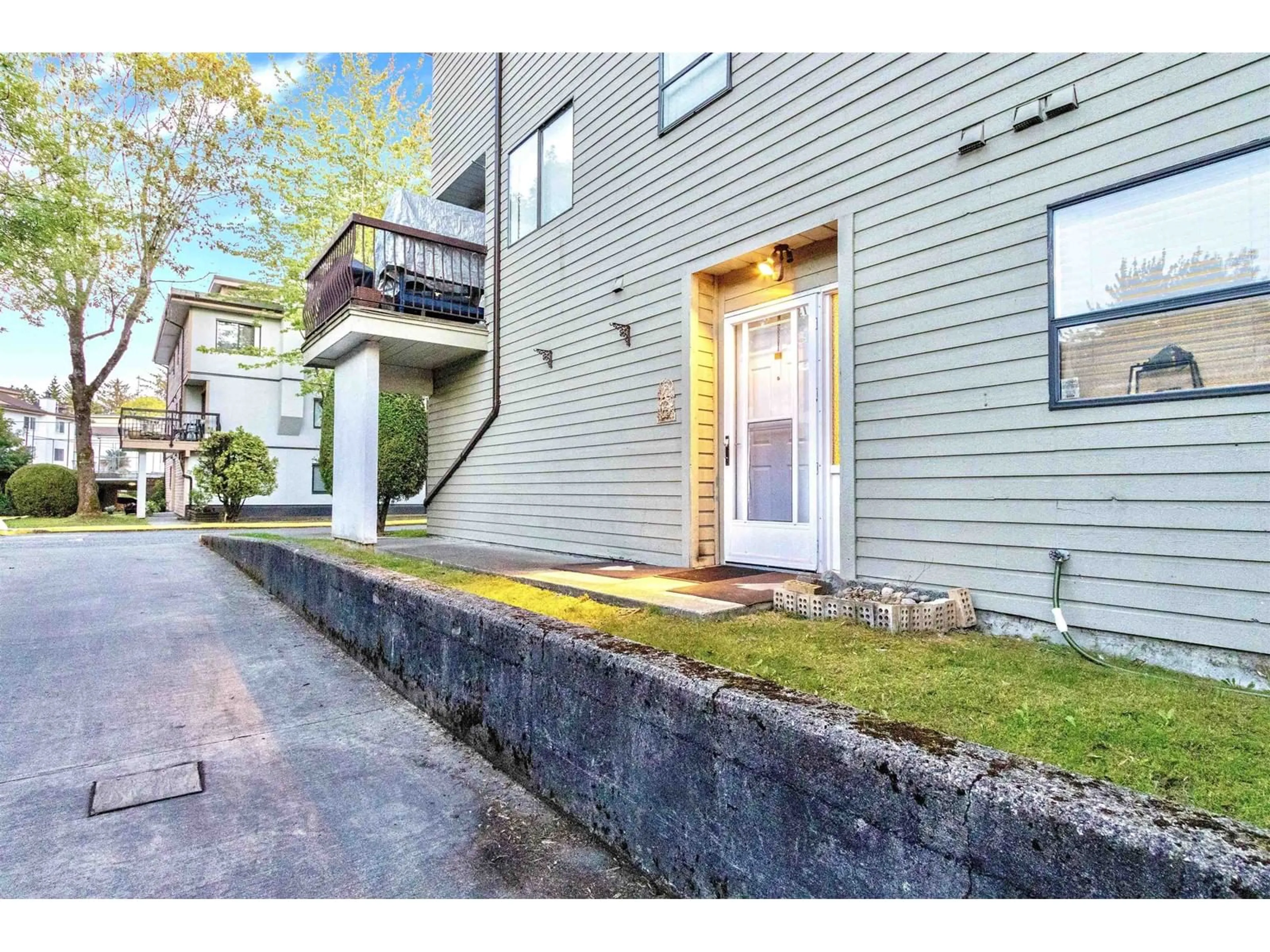 A pic from exterior of the house or condo, the street view for 104 7119 133 ST STREET, Surrey British Columbia V3W7Z6