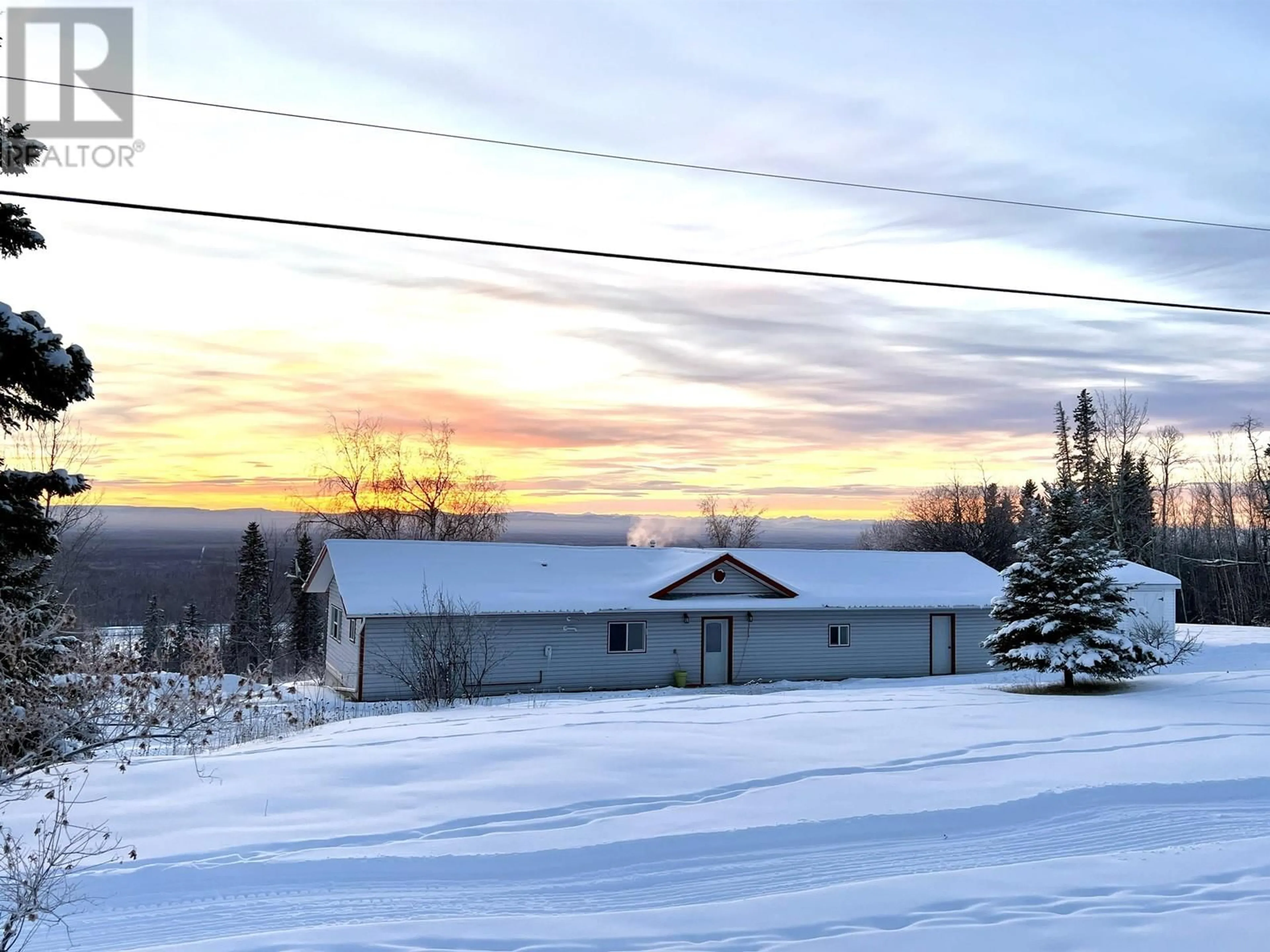 A pic from outside/outdoor area/front of a property/back of a property/a pic from drone, mountain view for 7511 HIGHLAND DRIVE, Fort Nelson British Columbia V0C1R0