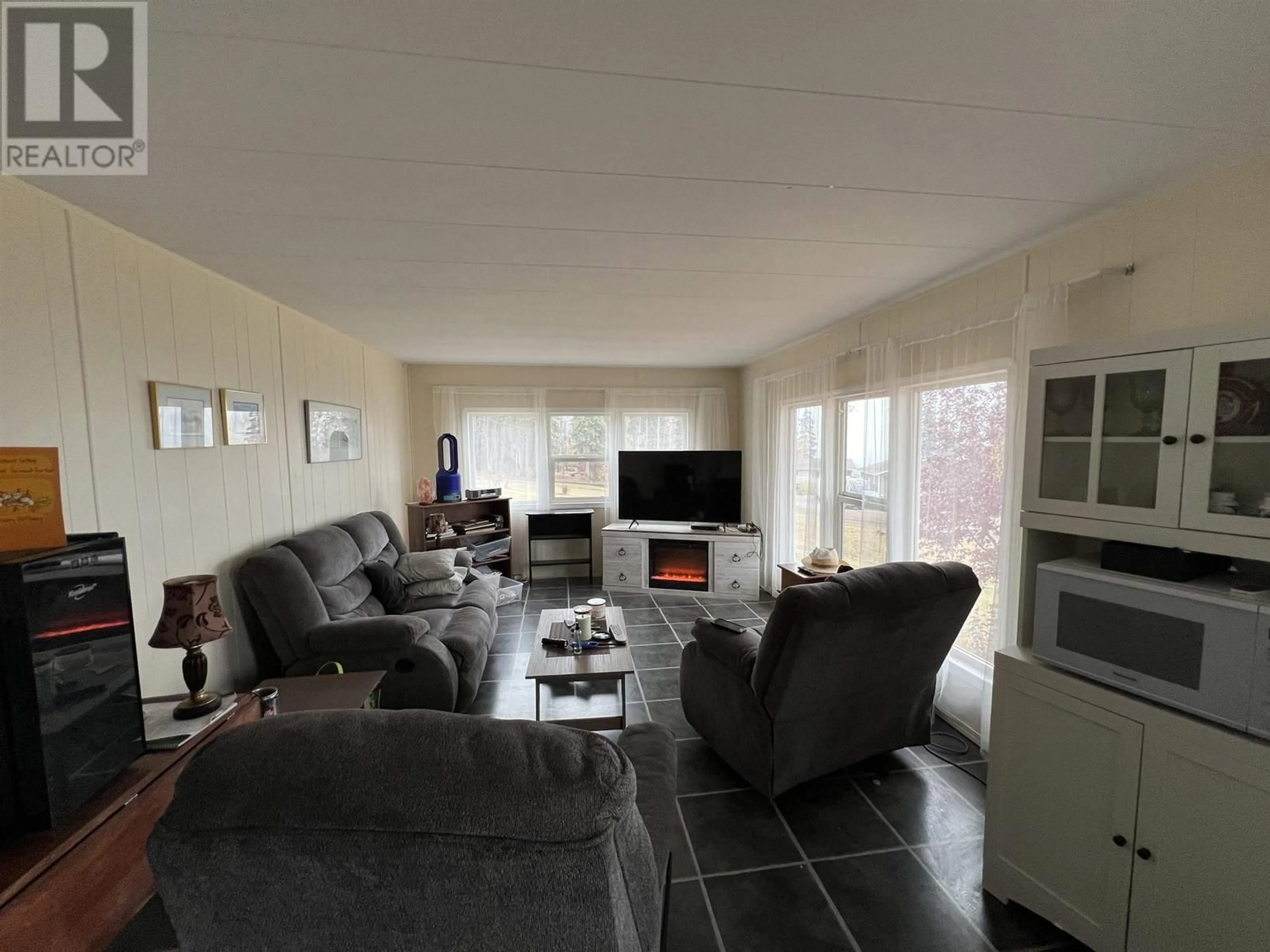 Living room with furniture, unknown for 7511 HIGHLAND DRIVE, Fort Nelson British Columbia V0C1R0
