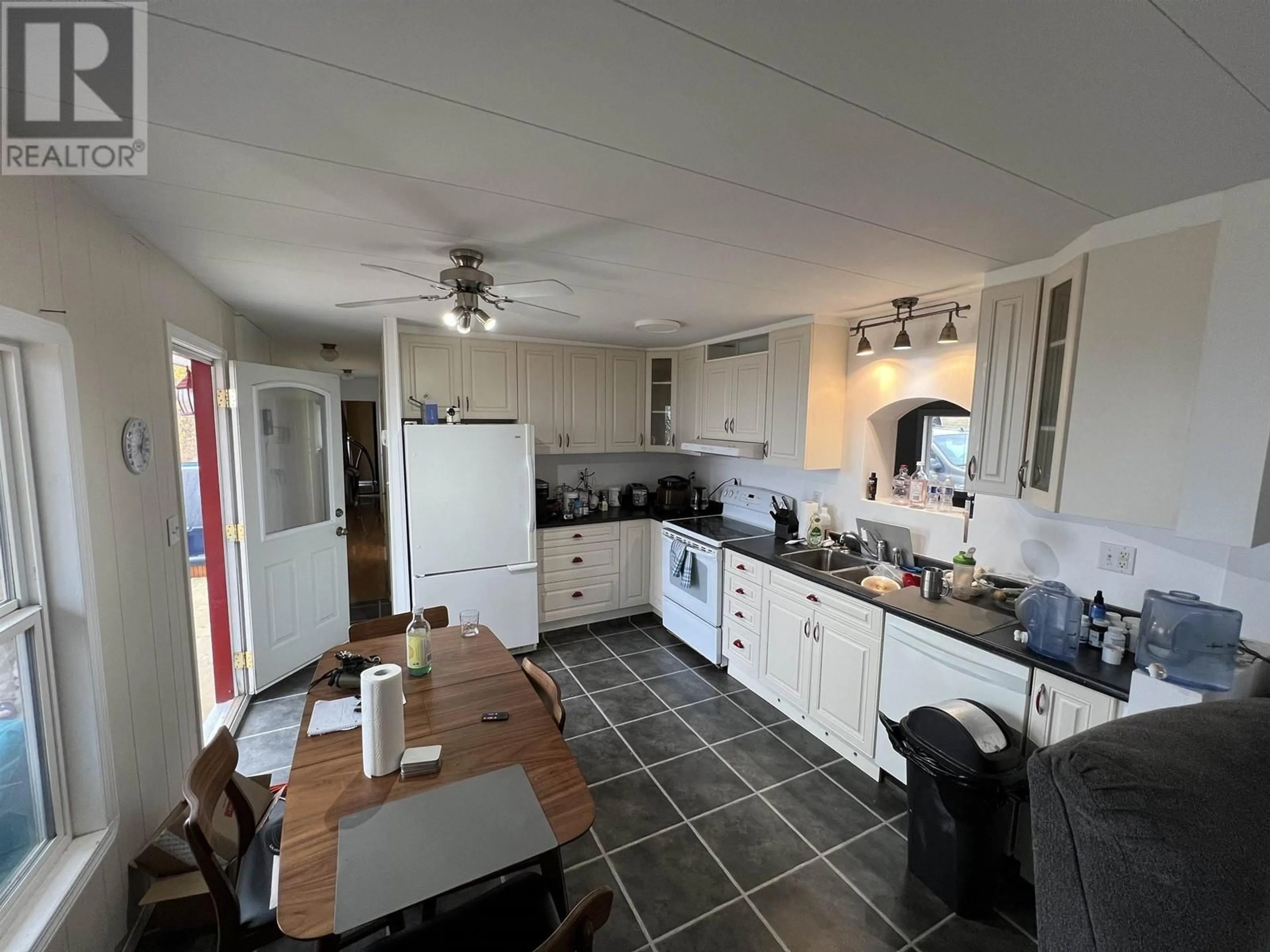 Standard kitchen, wood floors, cottage for 7511 HIGHLAND DRIVE, Fort Nelson British Columbia V0C1R0