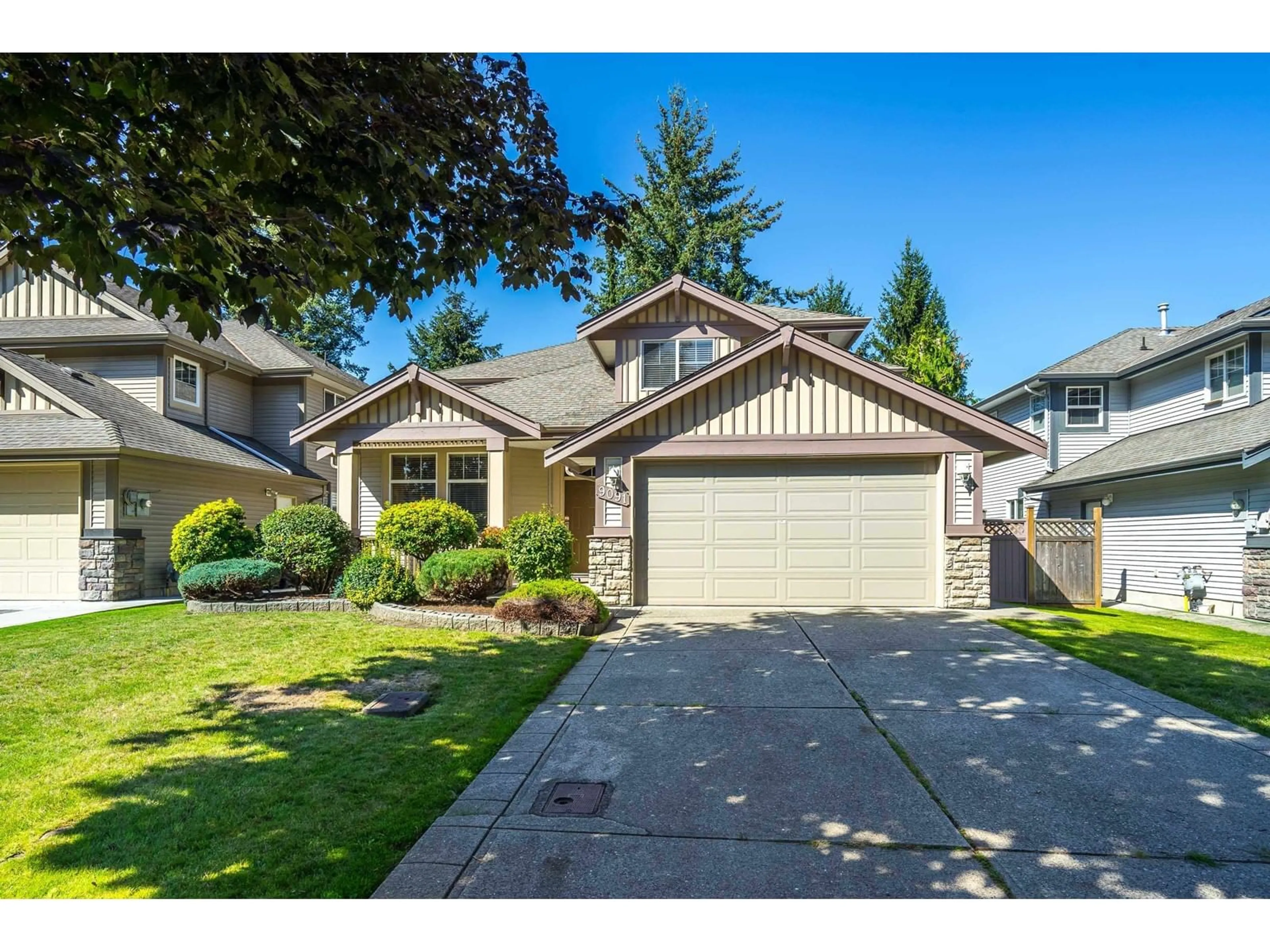 Frontside or backside of a home, the street view for 9091 202B STREET, Langley British Columbia V1M4C1