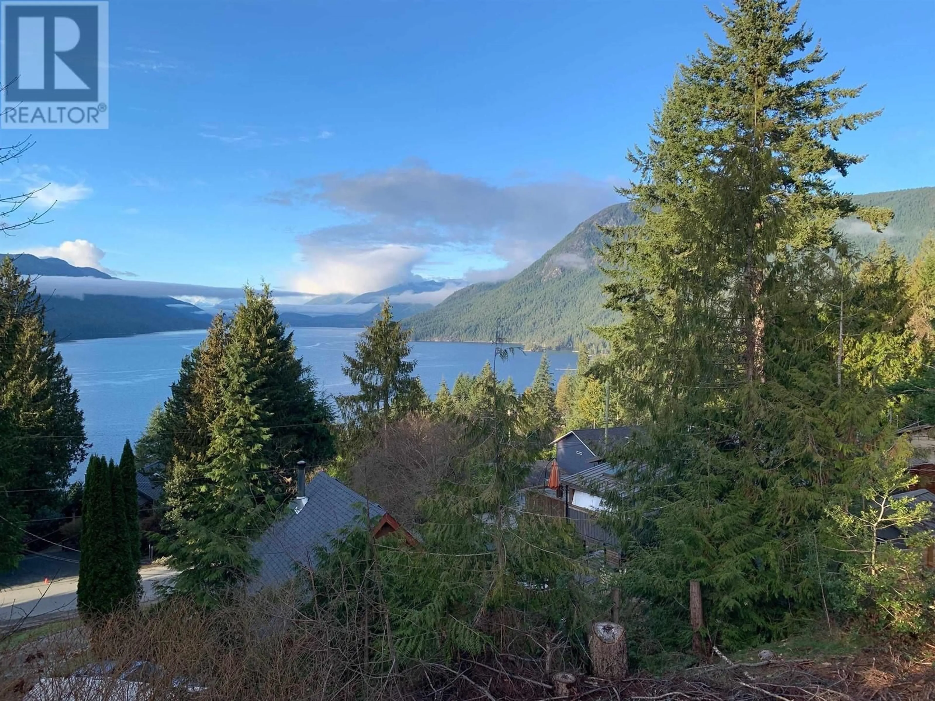 A pic from outside/outdoor area/front of a property/back of a property/a pic from drone, water/lake/river/ocean view for 5894 SKOOKUMCHUK ROAD, Sechelt British Columbia V7Z0E1