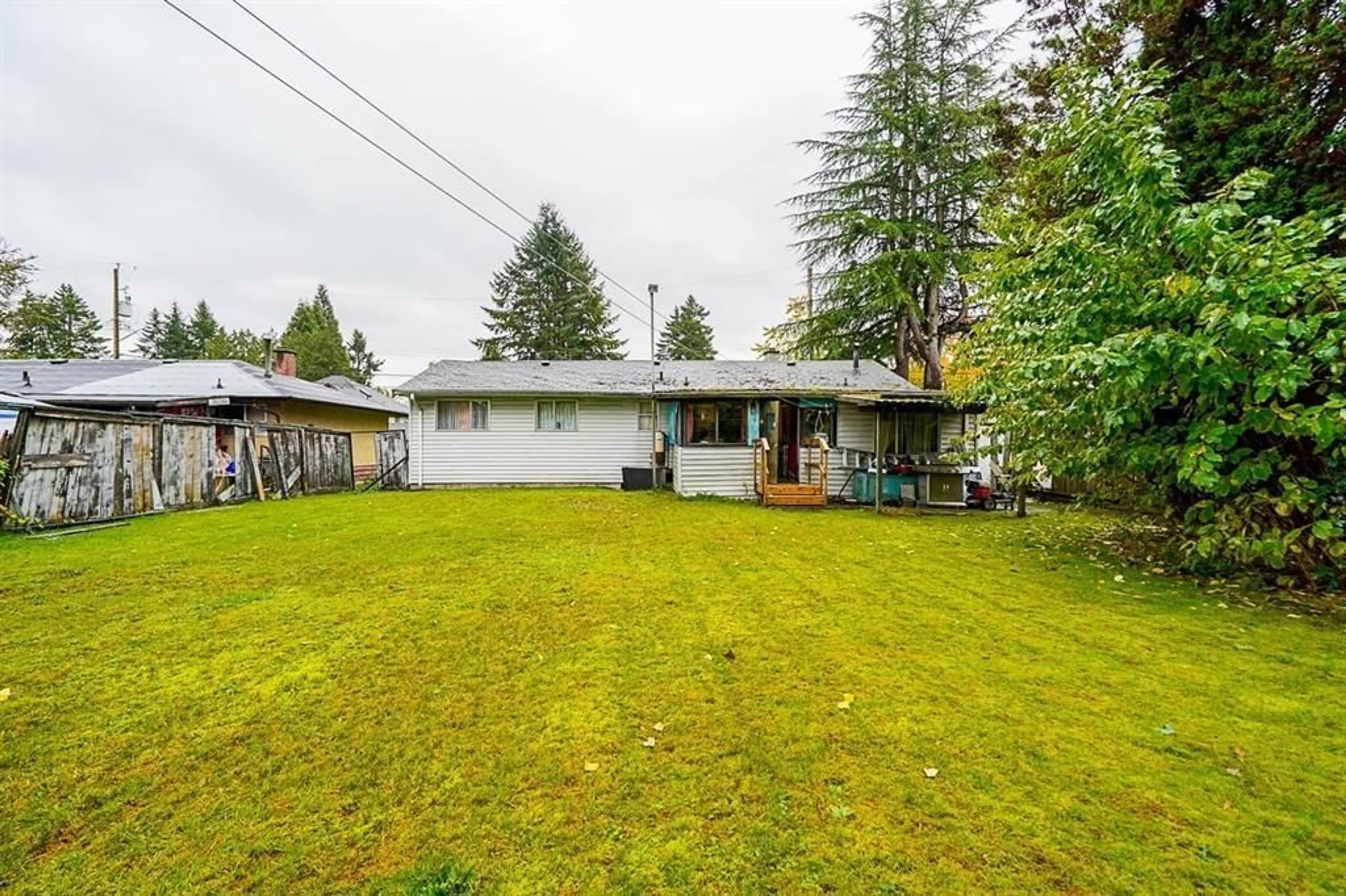 Frontside or backside of a home, the fenced backyard for 10331 155A STREET, Surrey British Columbia V3R4K4