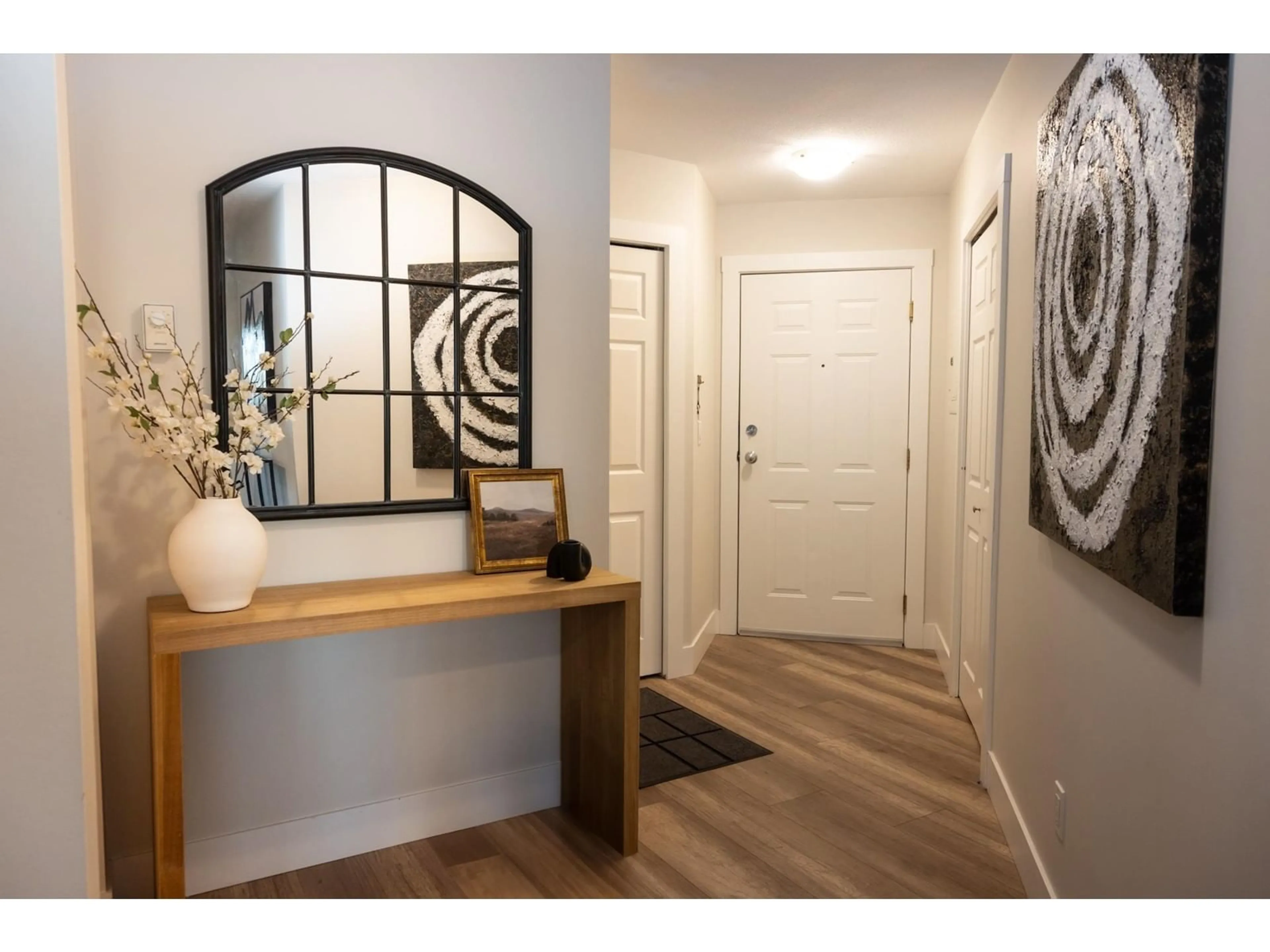 Indoor entryway, wood floors for 314 22025 48 AVENUE, Langley British Columbia V3A8L2