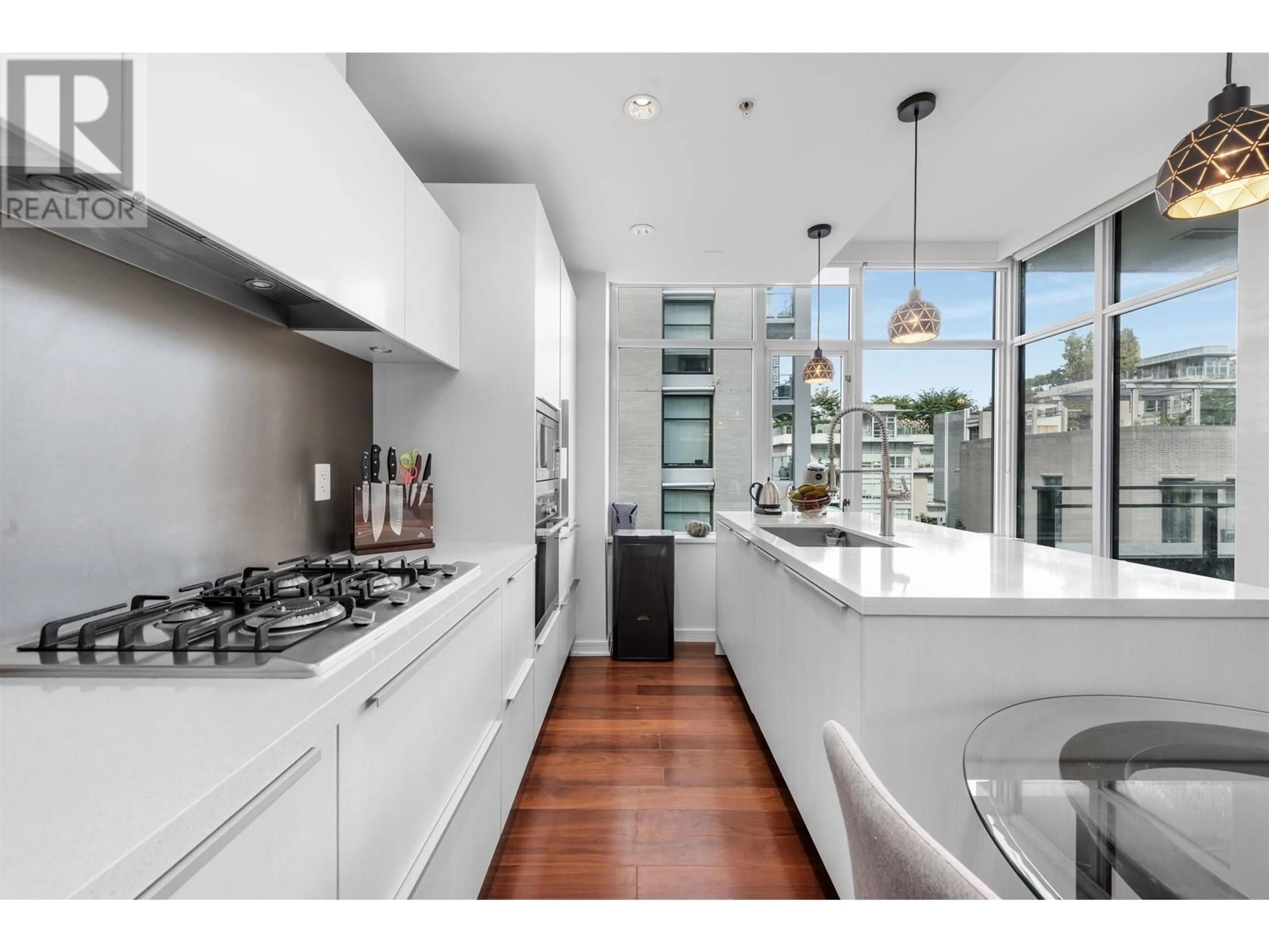 Contemporary kitchen, wood floors for 510 181 W 1ST AVENUE, Vancouver British Columbia V5Y0E3