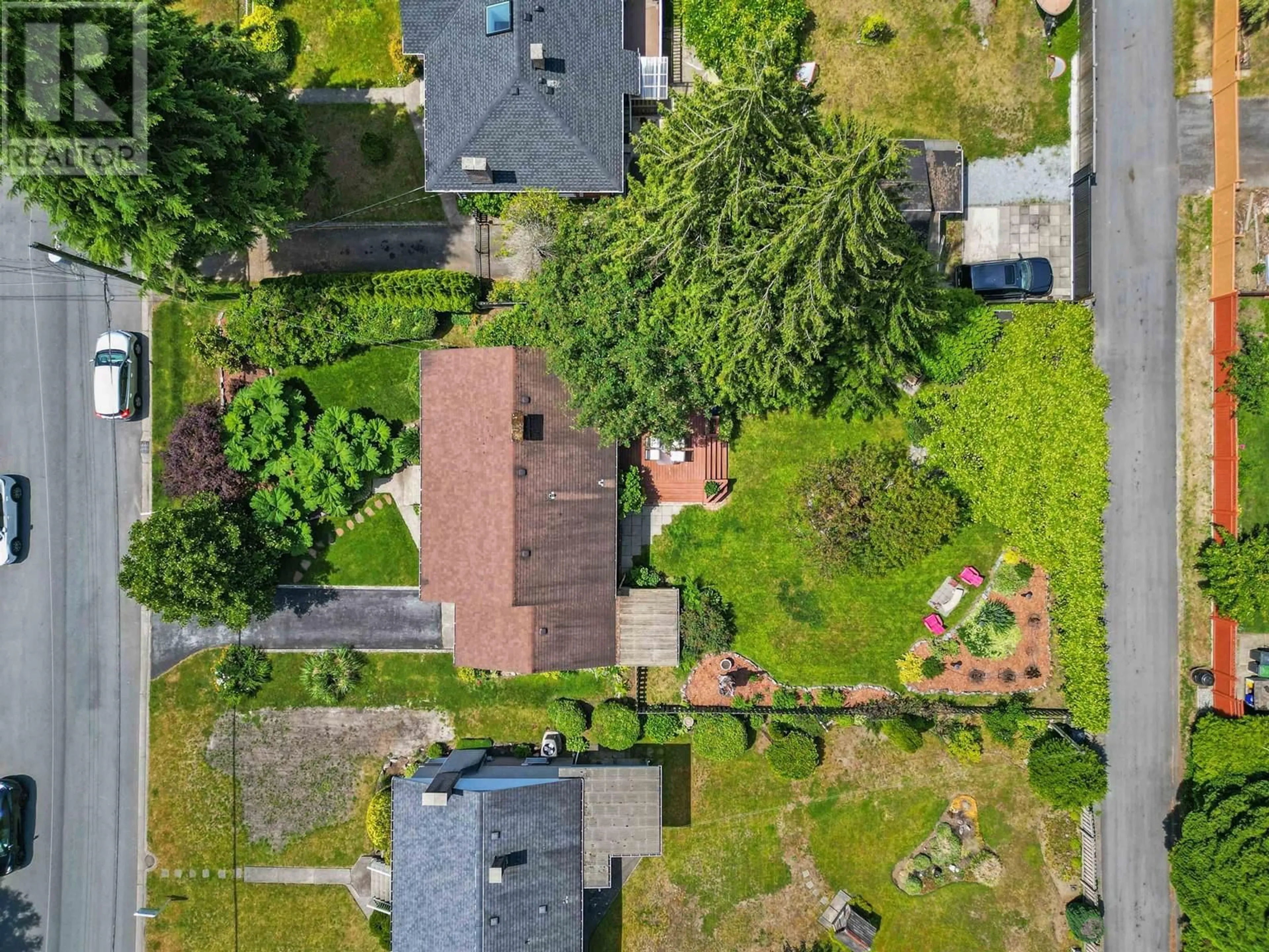 Frontside or backside of a home, the fenced backyard for 715 IVY AVENUE, Coquitlam British Columbia V3J2J2