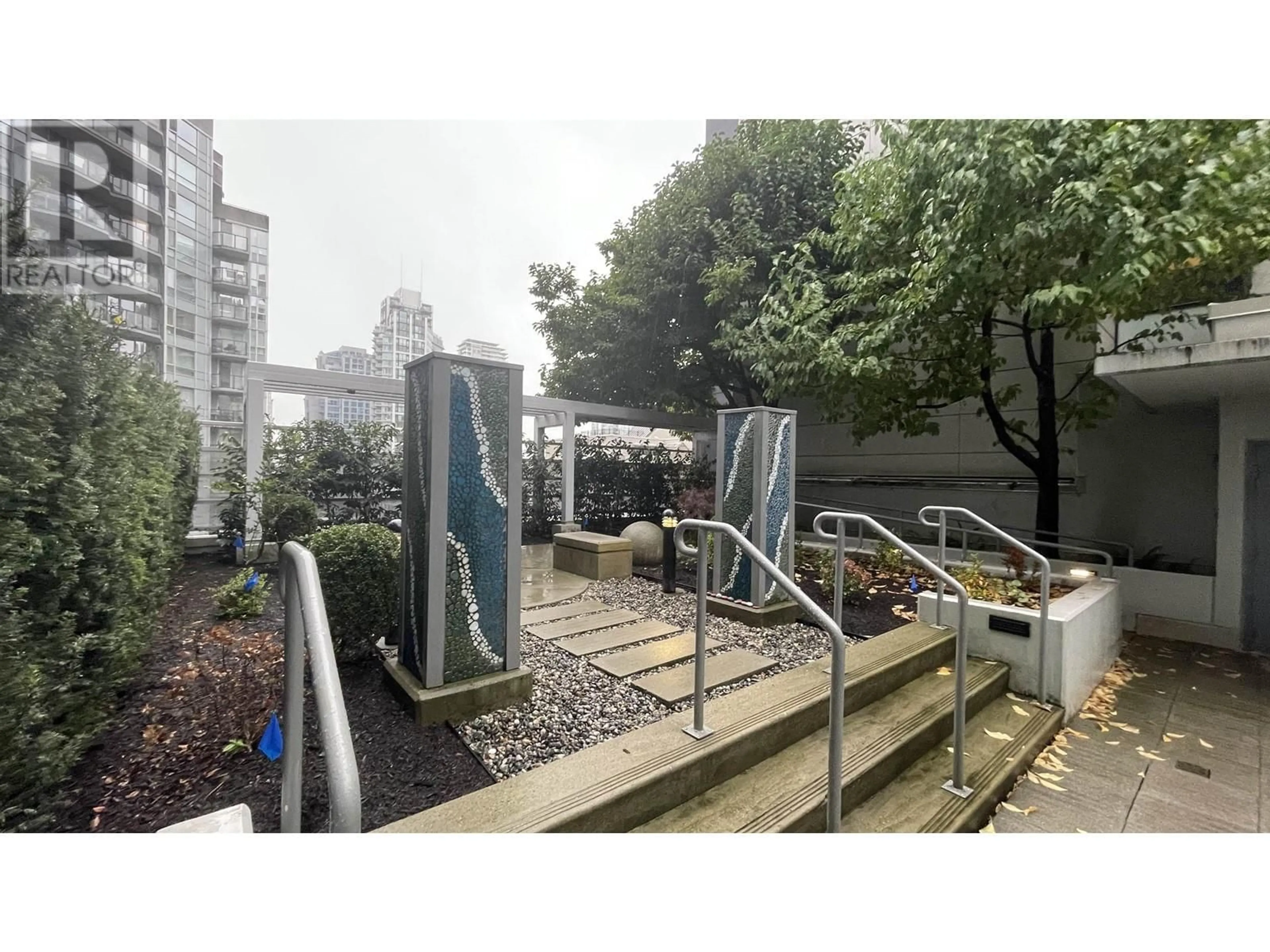 A pic from exterior of the house or condo, the fenced backyard for 1002 1205 HOWE STREET, Vancouver British Columbia V6Z0B2