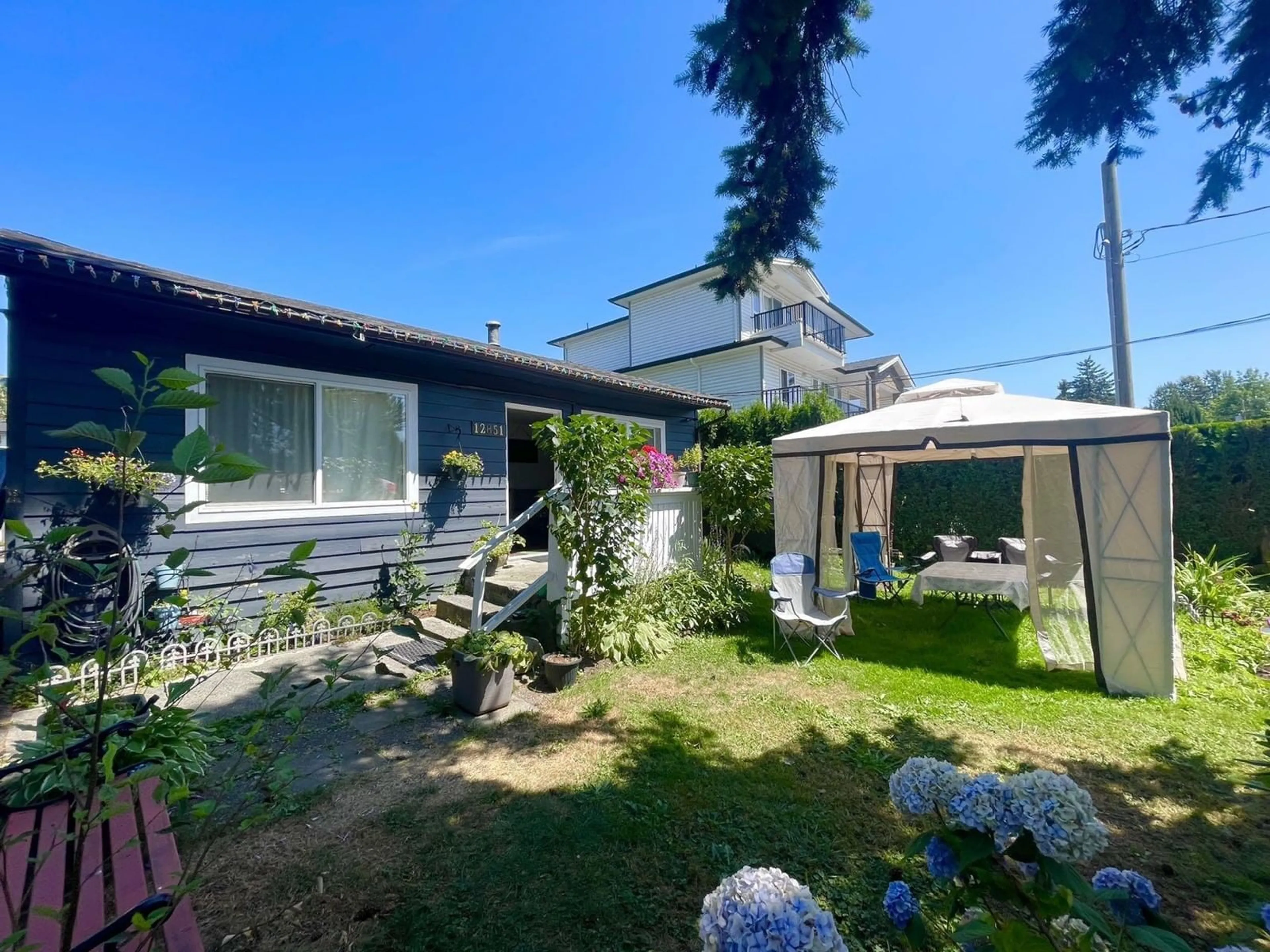 Frontside or backside of a home, cottage for 12851 115A AVENUE, Surrey British Columbia V3R2R3