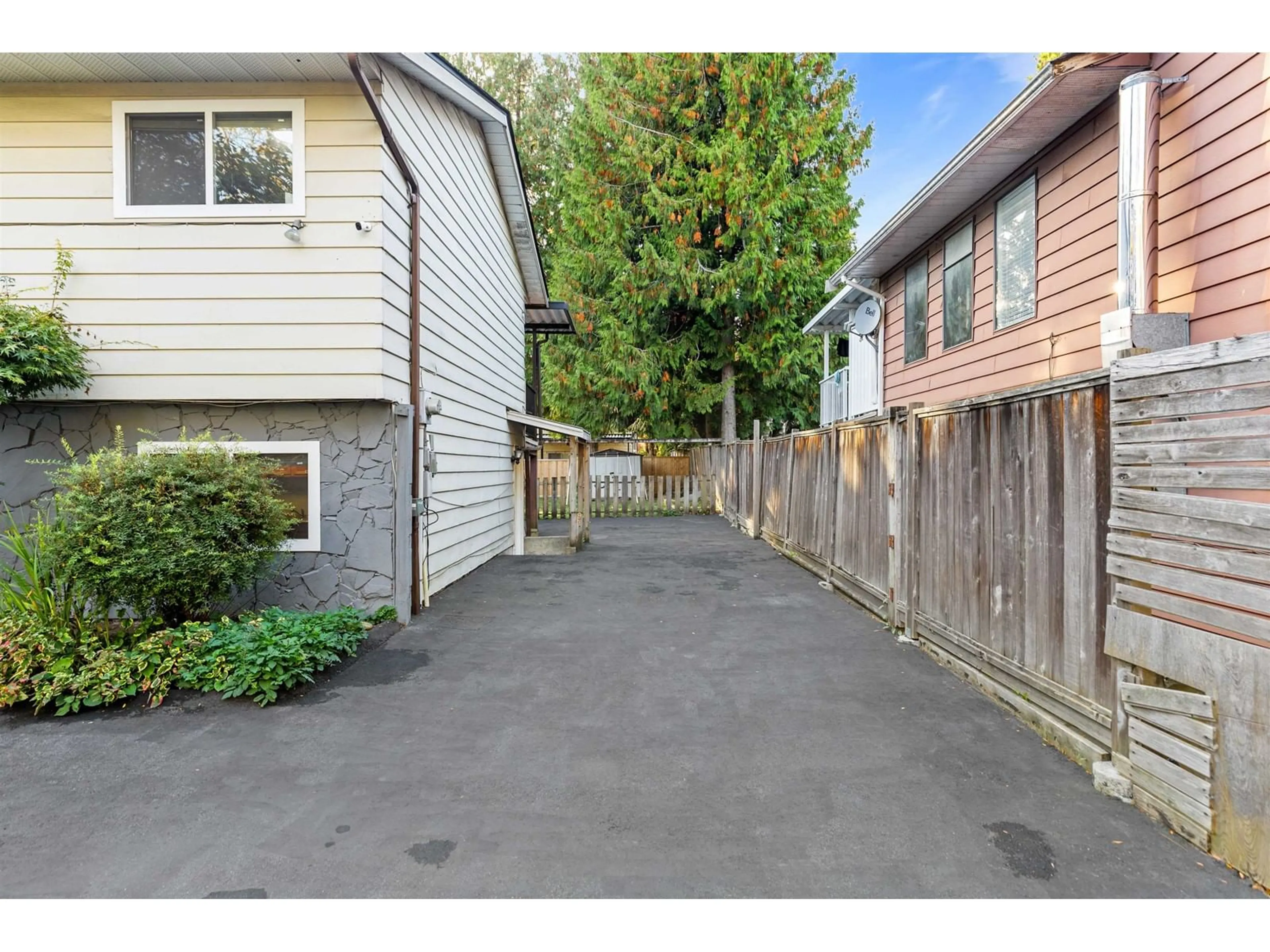 Frontside or backside of a home, the fenced backyard for 9127 146A STREET, Surrey British Columbia V3R6Z6