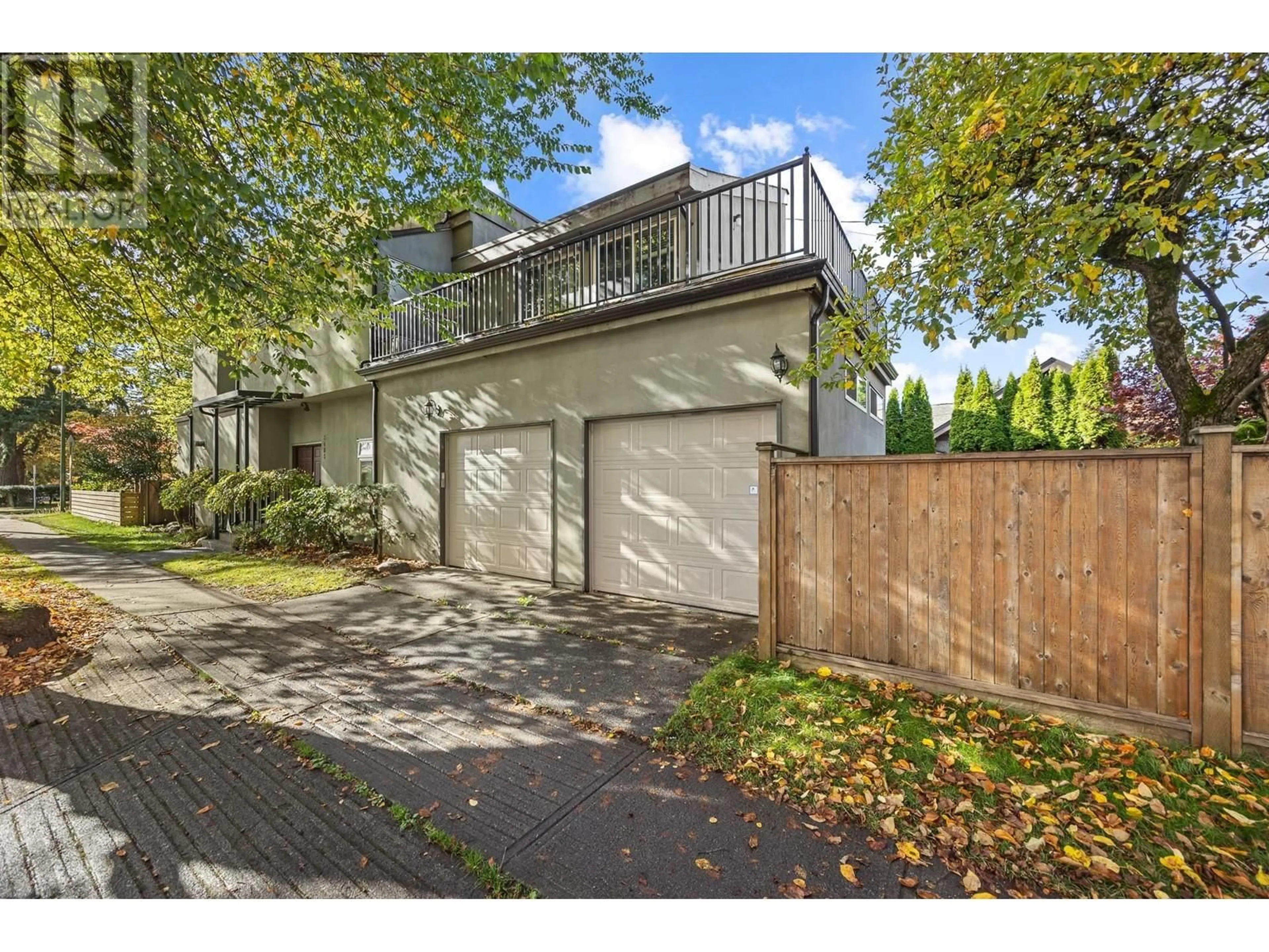 A pic from exterior of the house or condo, the fenced backyard for 5483 CARNARVON STREET, Vancouver British Columbia V6N4G1