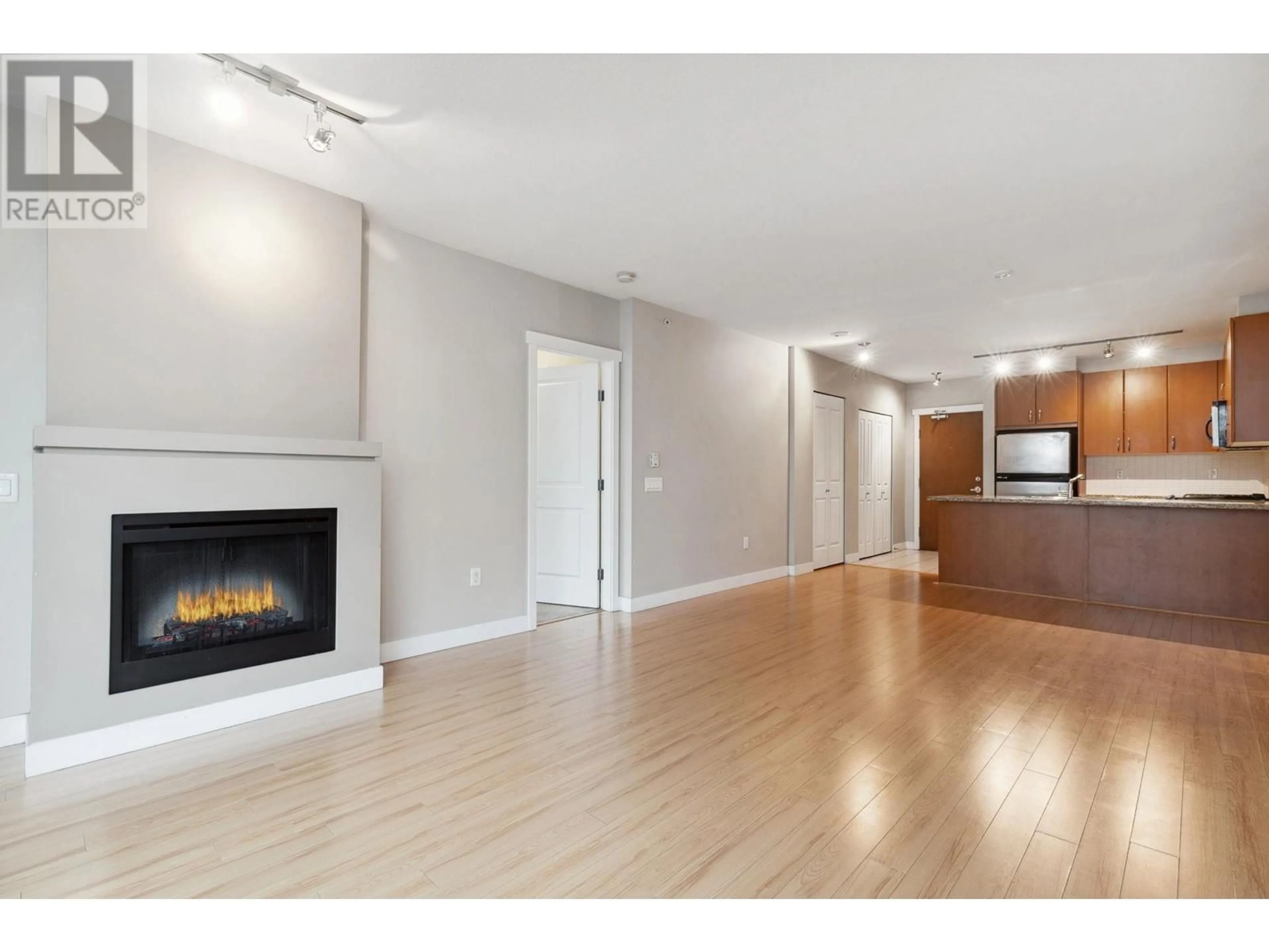 A pic of a room, wood floors for 302 9222 UNIVERSITY CRESCENT, Burnaby British Columbia V5A0A6