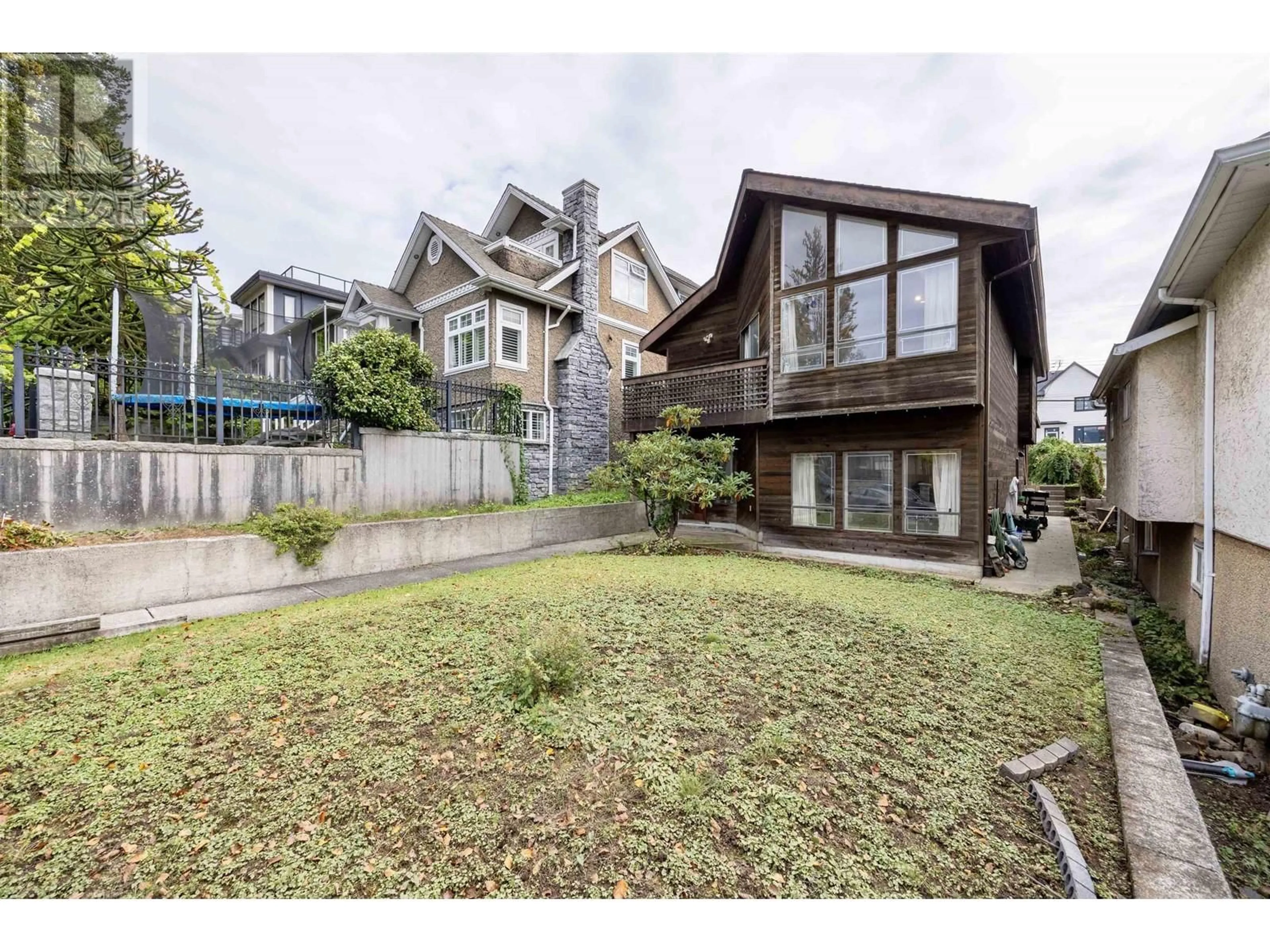 Frontside or backside of a home, the fenced backyard for 3542 ETON STREET, Vancouver British Columbia V5K1K7