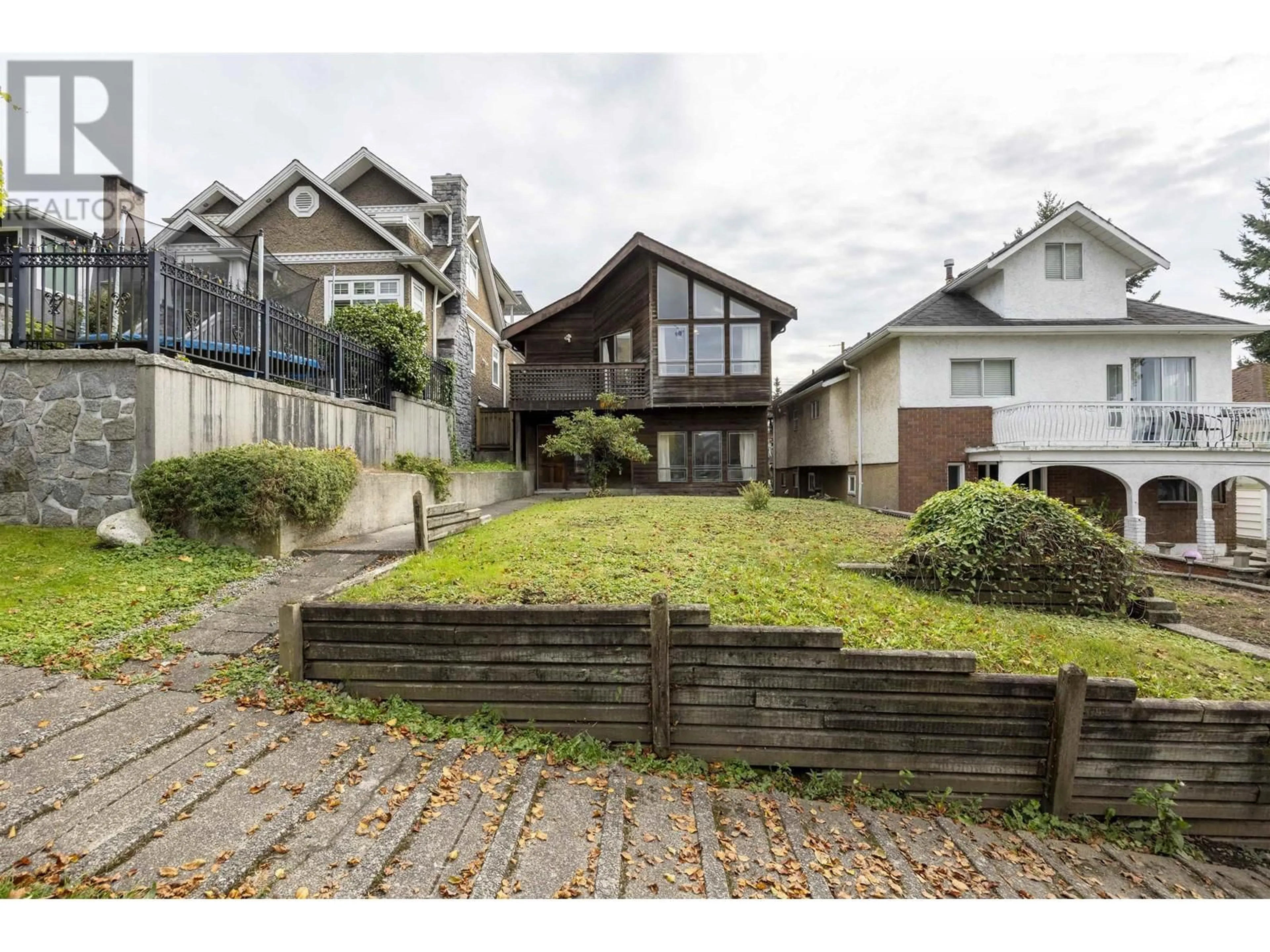 Frontside or backside of a home, the fenced backyard for 3542 ETON STREET, Vancouver British Columbia V5K1K7